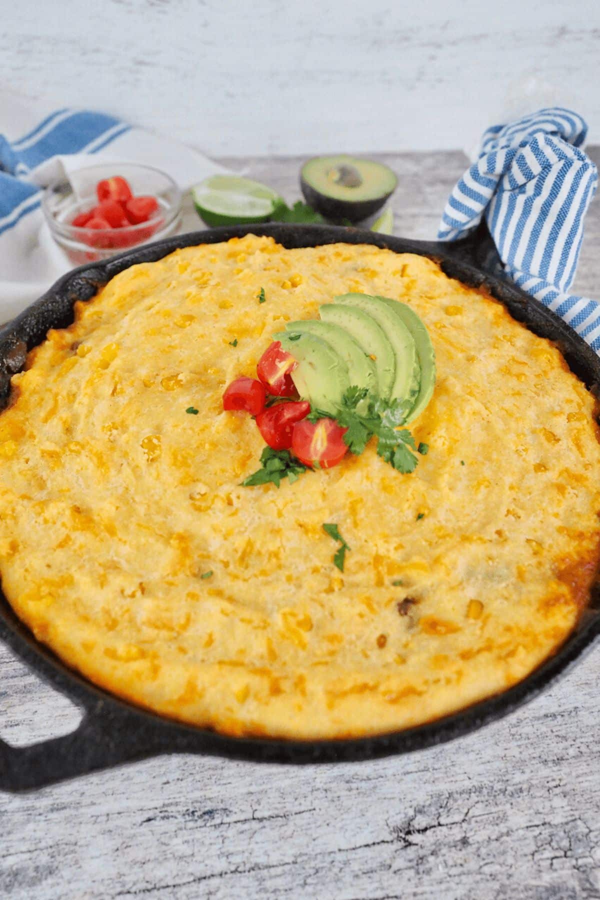 Easy Tamale Pie with Cornmeal Crust in a black skillet.