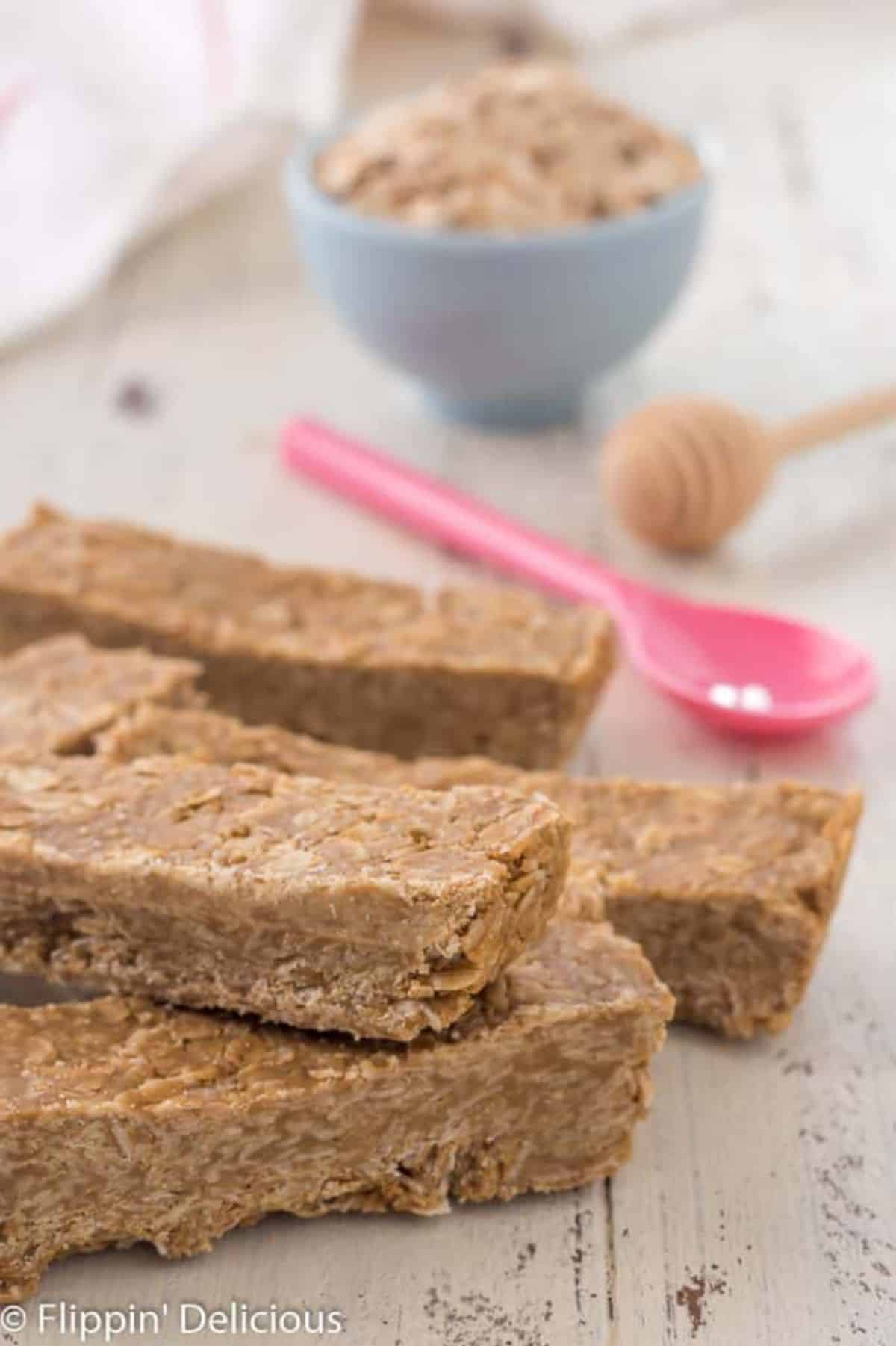 Gluten-Free SunButter Honey Granola Bars on a wooden table.