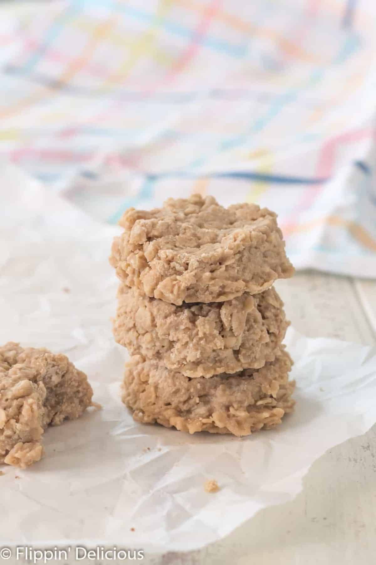 A stack of Gluten-Free No-Bake Cookies on a baking paper.