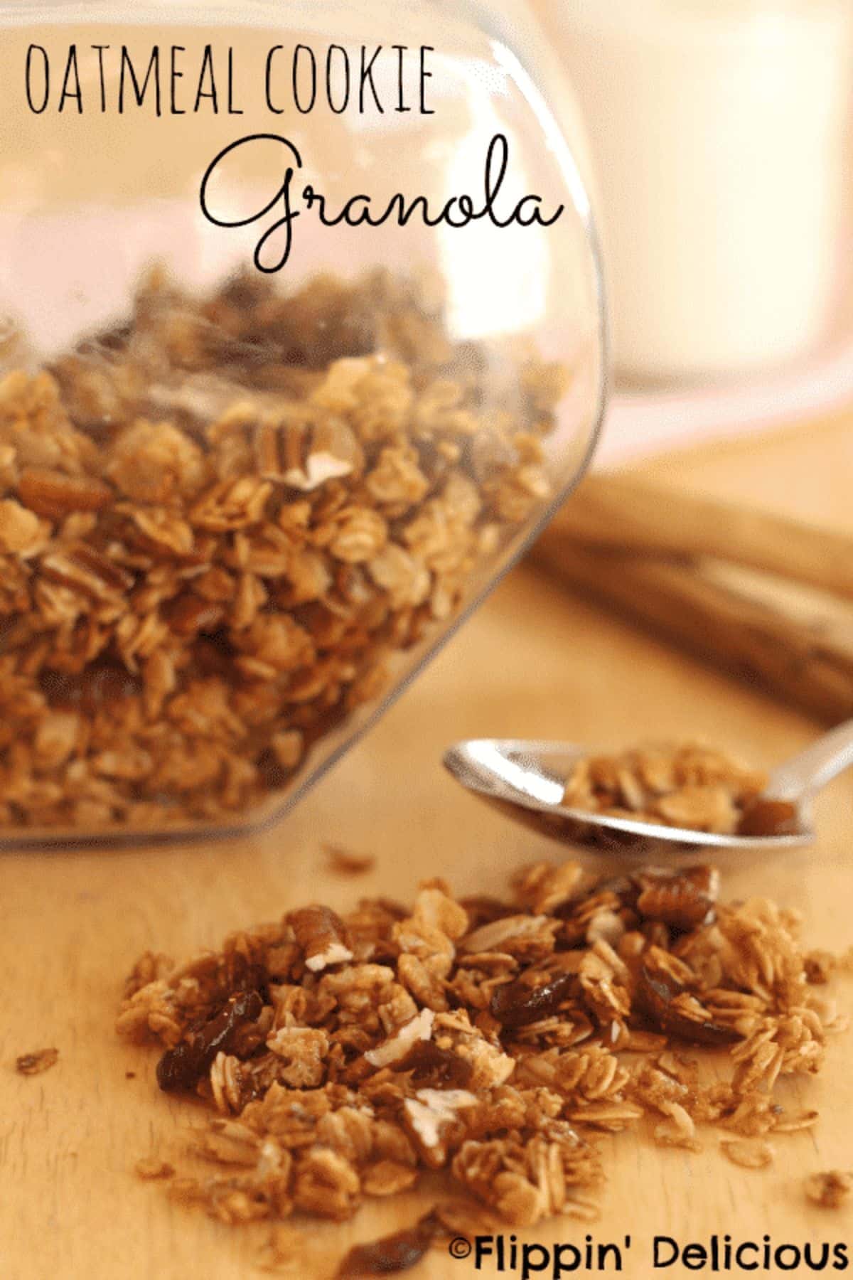 Gluten-free Oatmeal Cookie Granola in a glass jar on a wooden board.