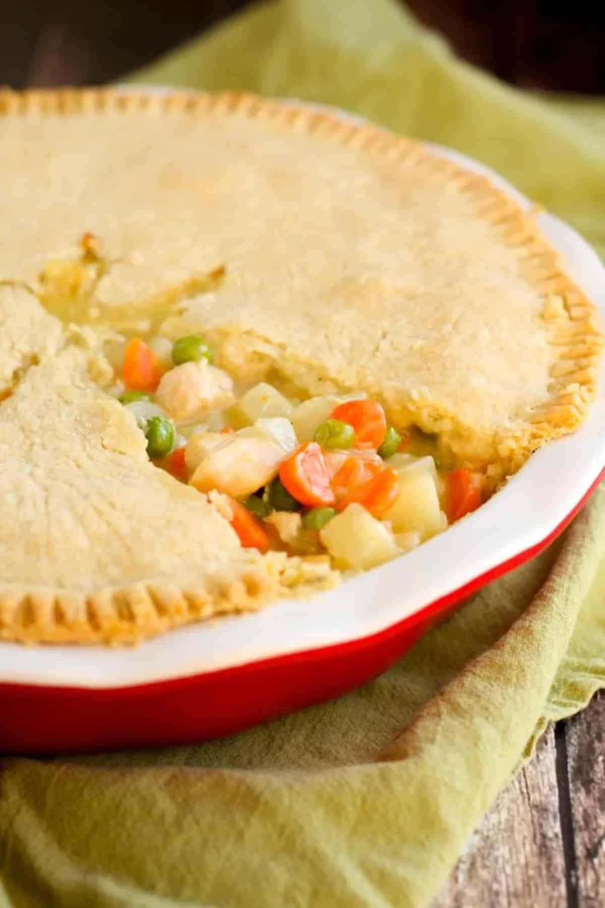 Gluten-Free Chicken Pot Pie on a piece of cloth on a wooden table.