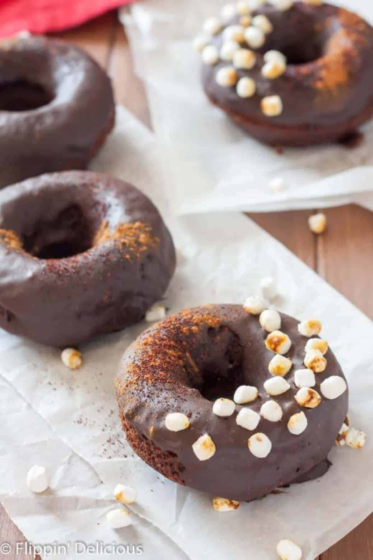 Dairy-Free Gluten-Free Mexican Hot Chocolate Donuts on paper napkins.