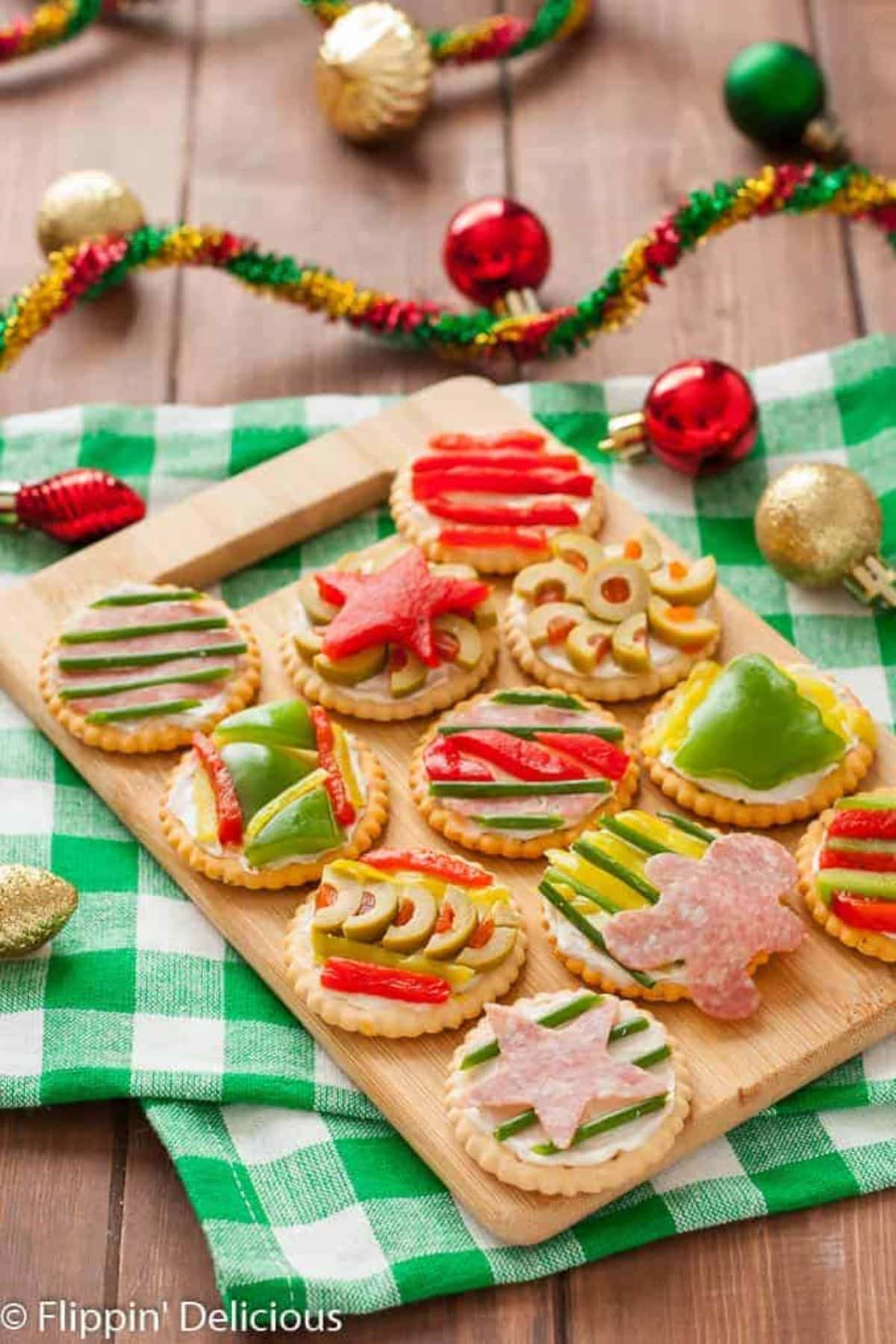 Ugly Holiday Sweater Party Crackers on a wooden cutting board.