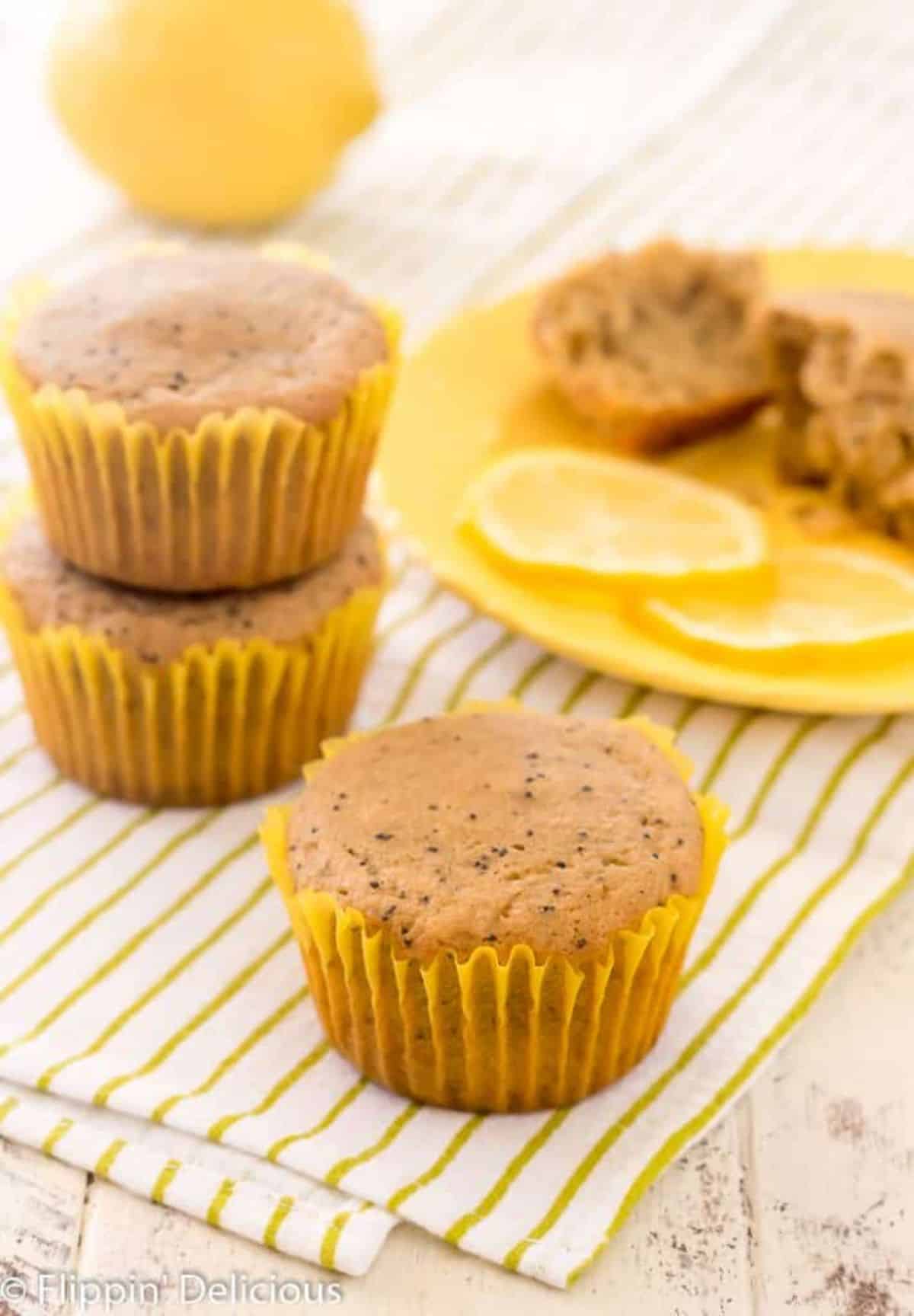 Almond Flour Lemon Poppy Seed Muffins on a piece of cloth.