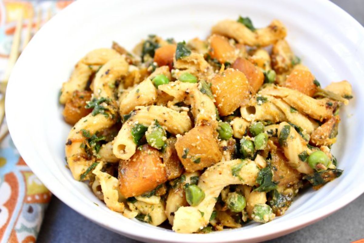 Butternut Squash and Sweet Pea Sage Pasta on a white plate.