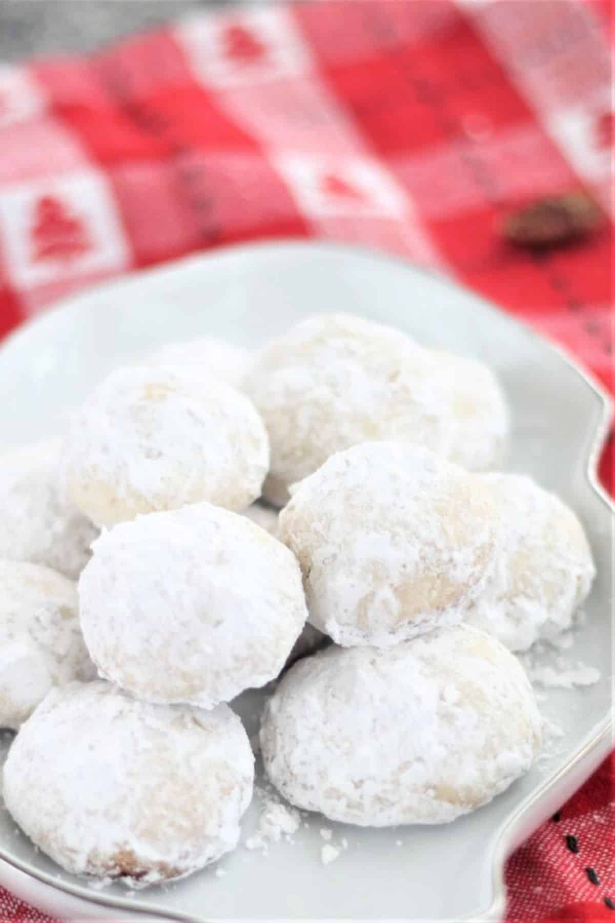 Gluten-Free Mexican Wedding Cookies on a white plate.