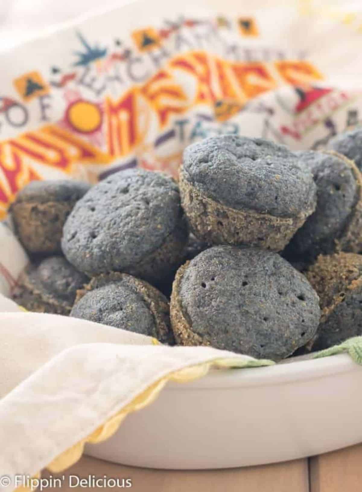 Gluten-free Blue Corn Muffins in a white bowl.