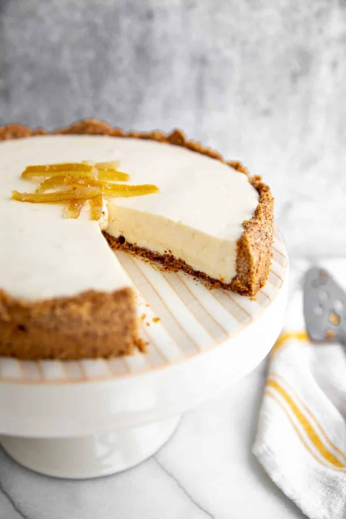 Creamy Lemon Pie with Easy Almond Crust on a cake tray.