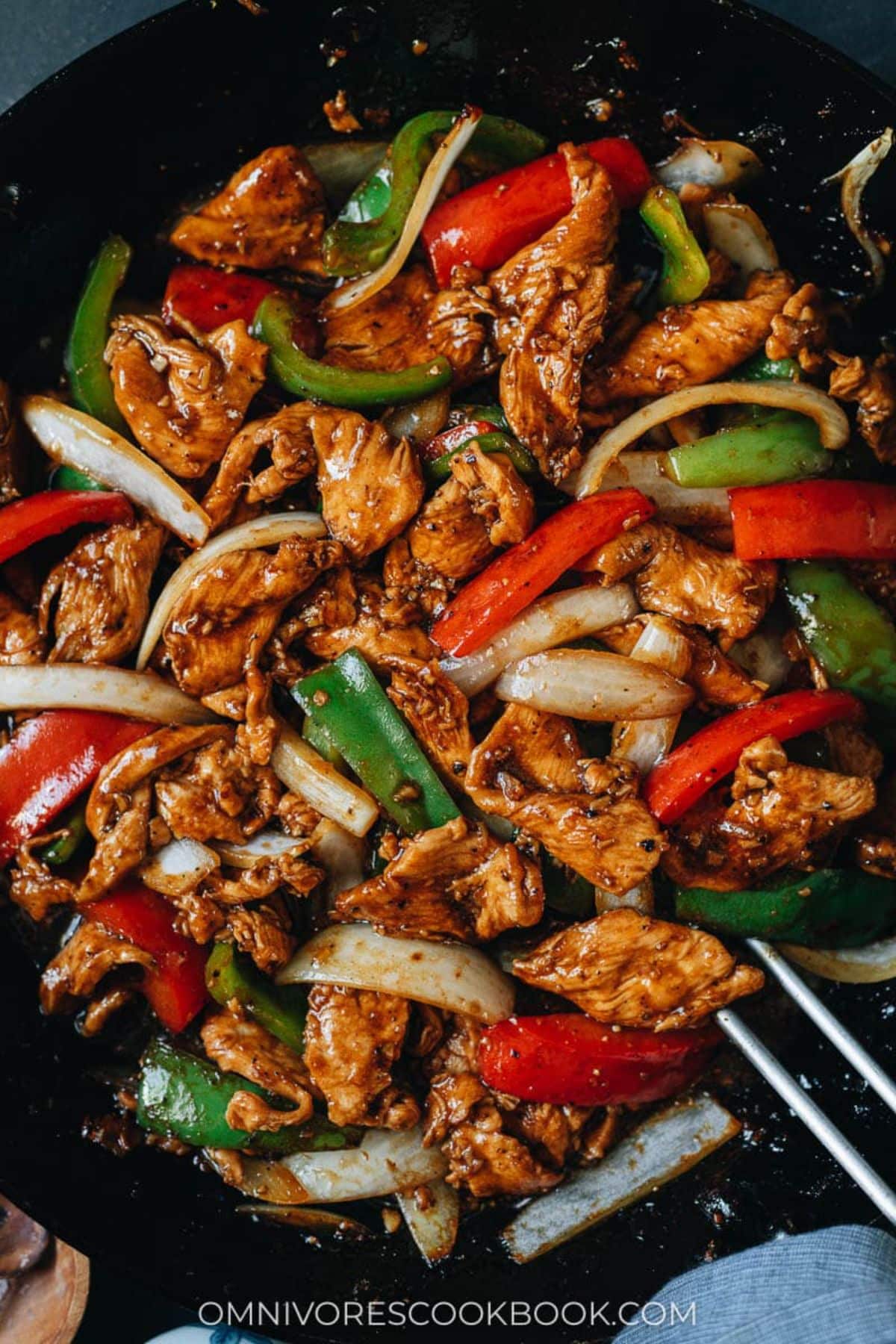 Black Pepper Chicken in a black pan.