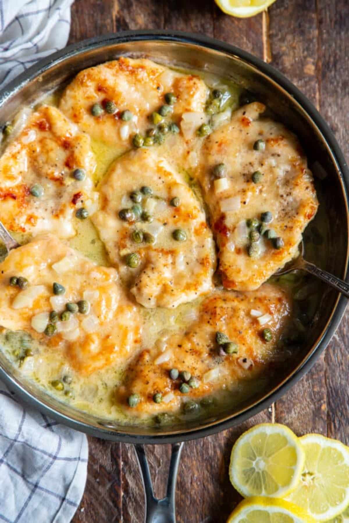 Gluten-Free Lemon Chicken Piccata in a black pan.