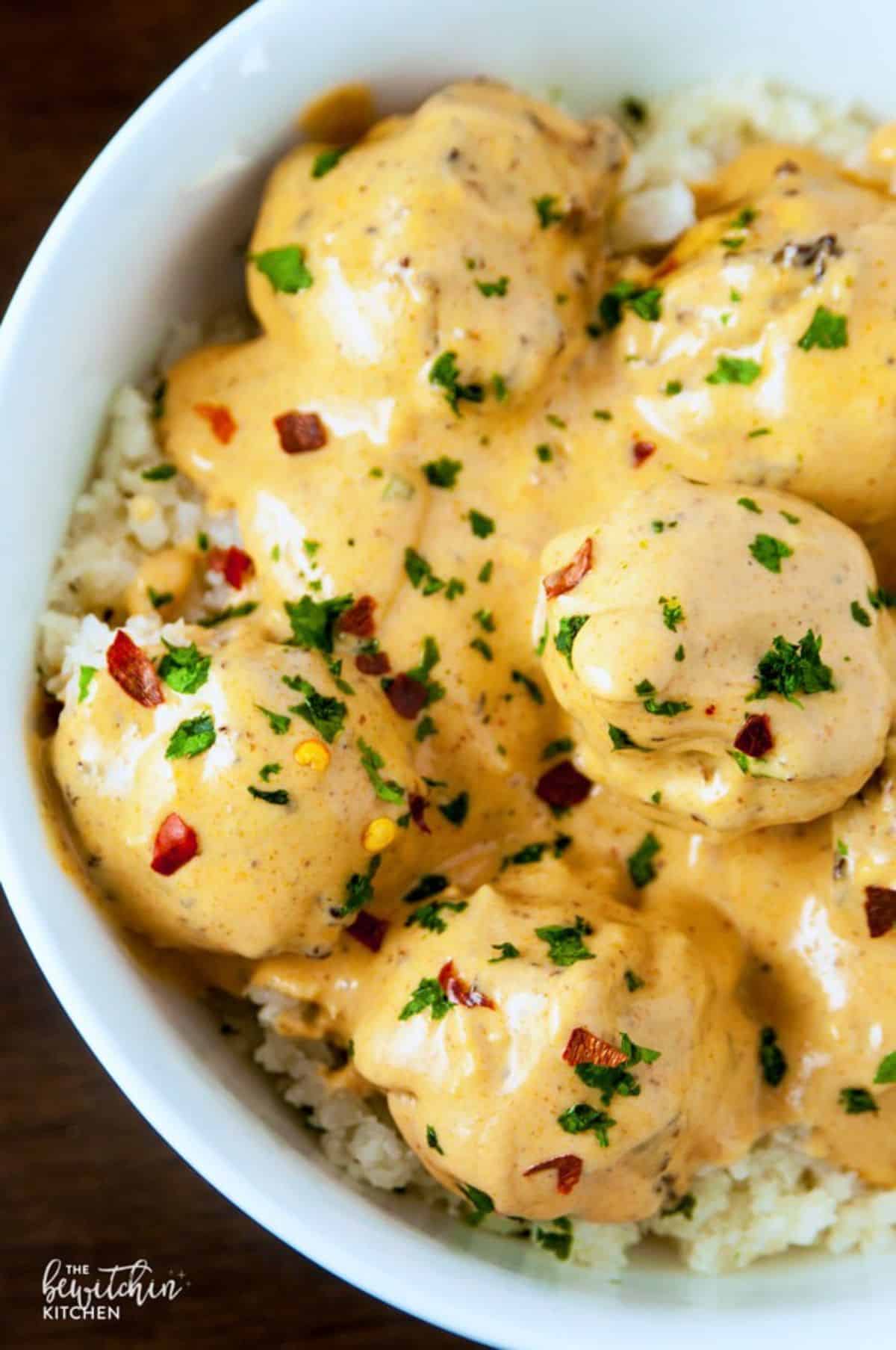 Coconut Curry Baked Chicken Meatballs in a light-blue bowl.