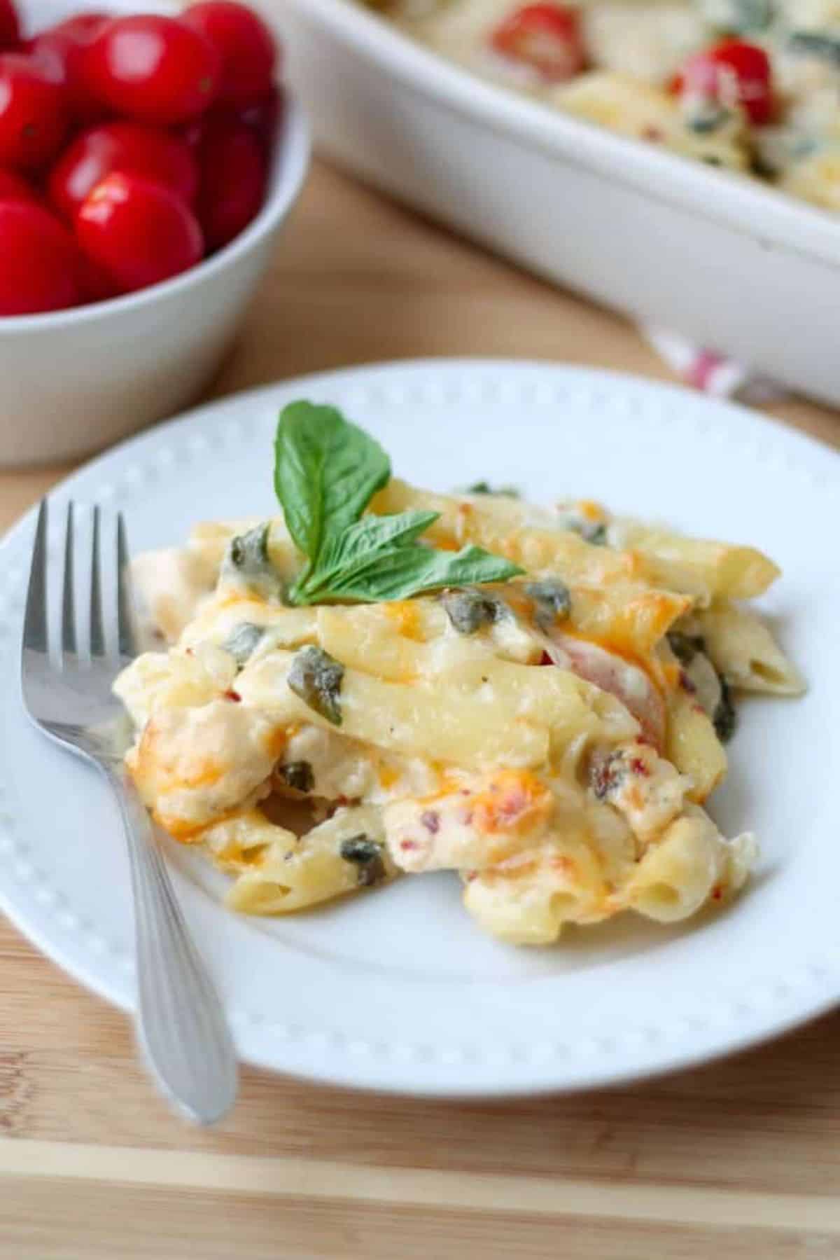 Creamy Garden Fresh Pasta Bake on a white plate with a fork.