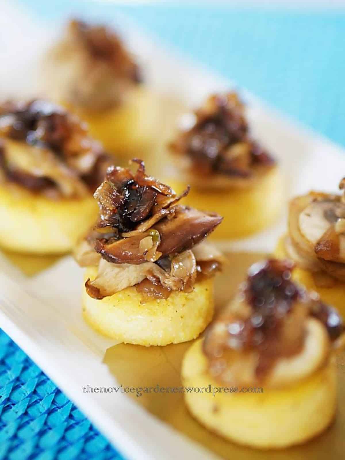 Polenta Mushroom Canapés on a white tray.