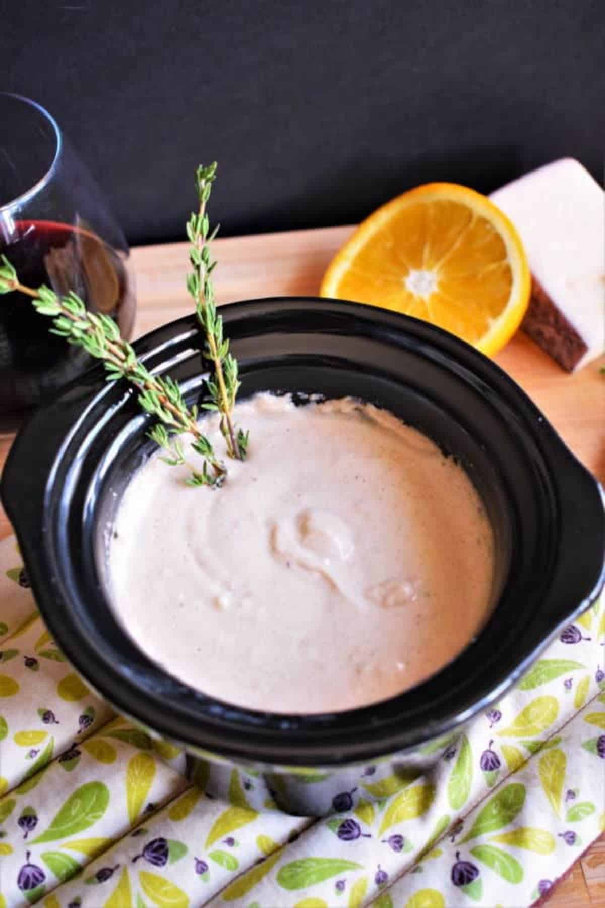 Red Wine and Cheese Dip in a black bowl.