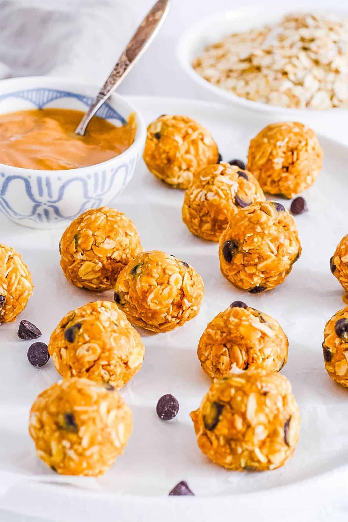 Gluten-free Peanut Butter Bliss Balls on a white tray.