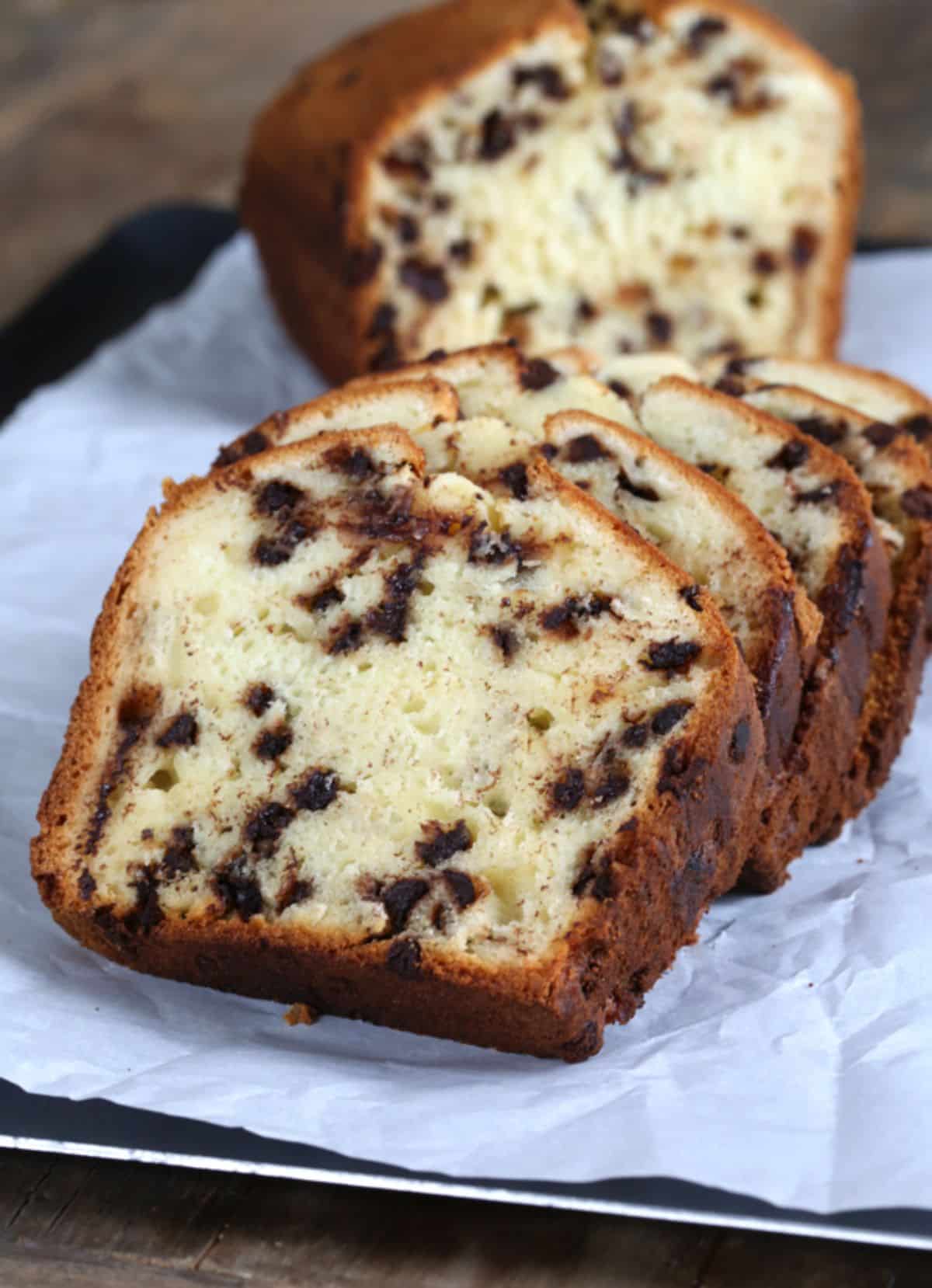 Gluten-Free Chocolate Chip Yogurt Quick Bread on a black tray with parchment paper.