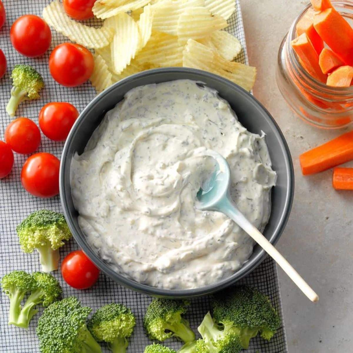 Dill Dip in a gray bowl with a spoon,
