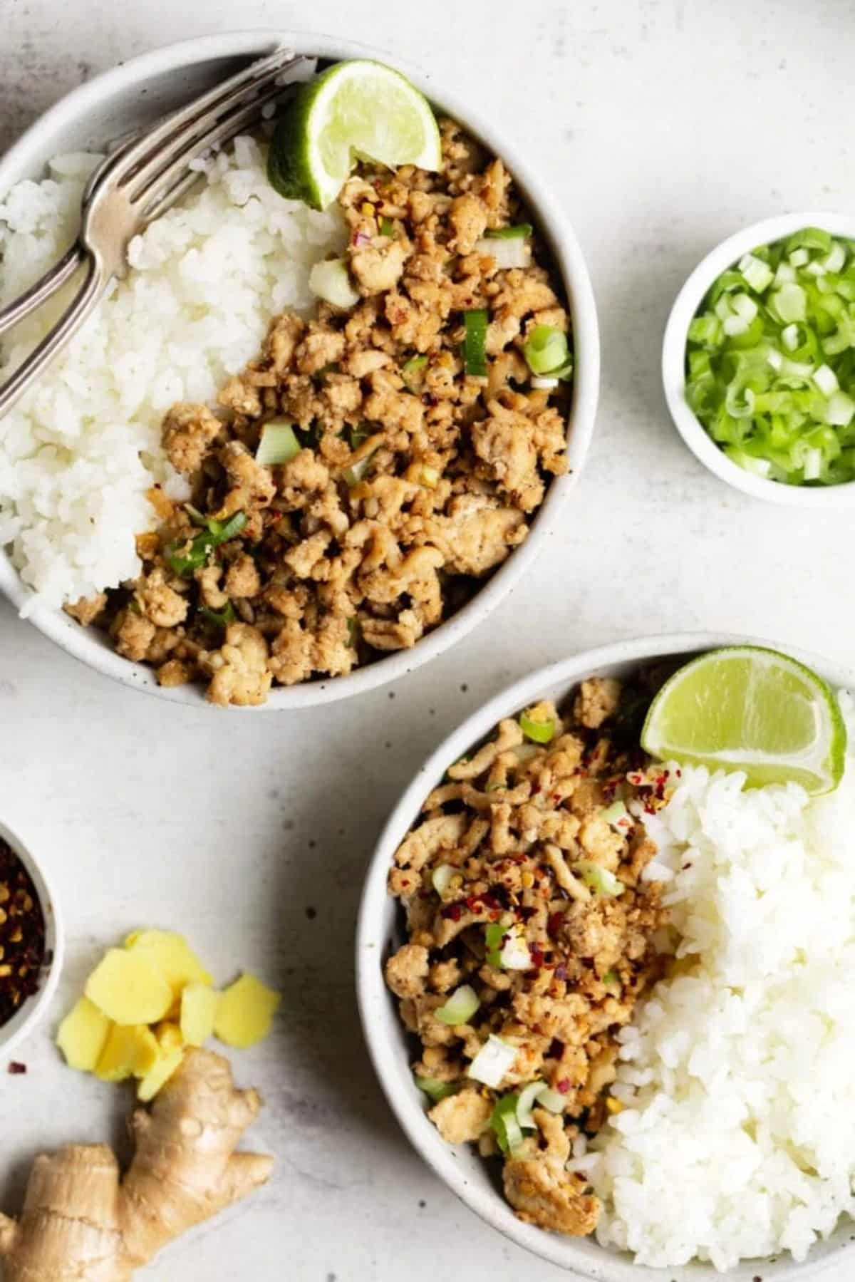 Asian Chicken Stir Fry in two white bowls.