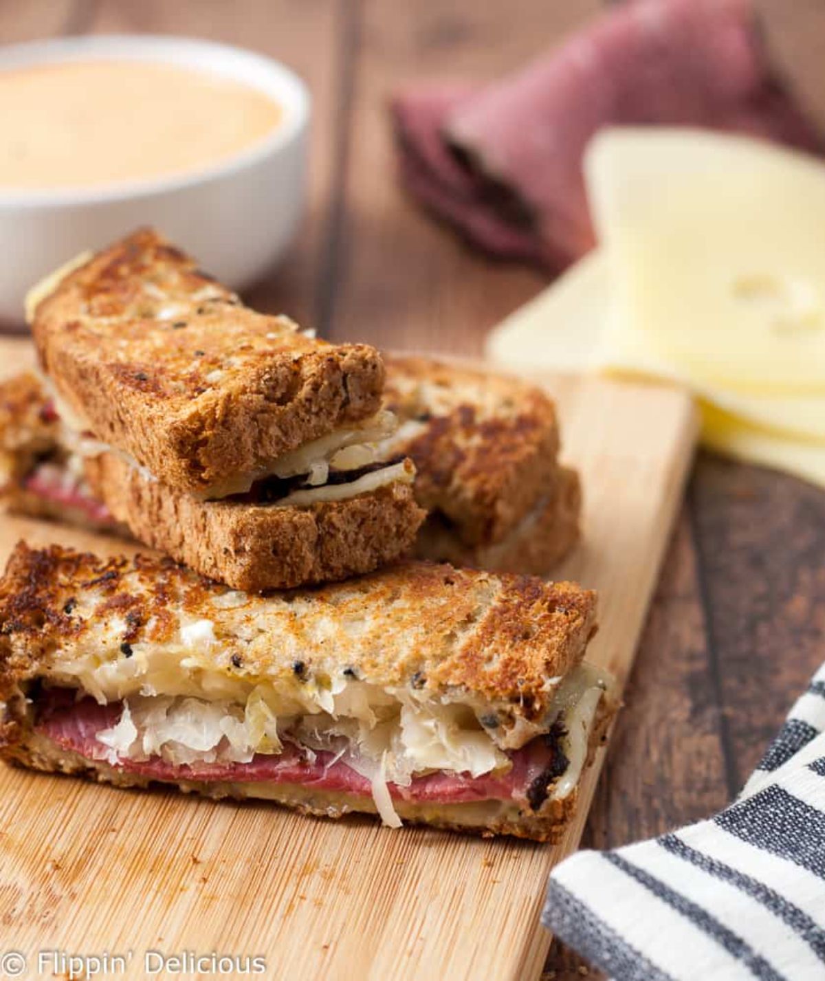 Gluten-Free Reuben Sandwich Dippers on a wooden cutting board.