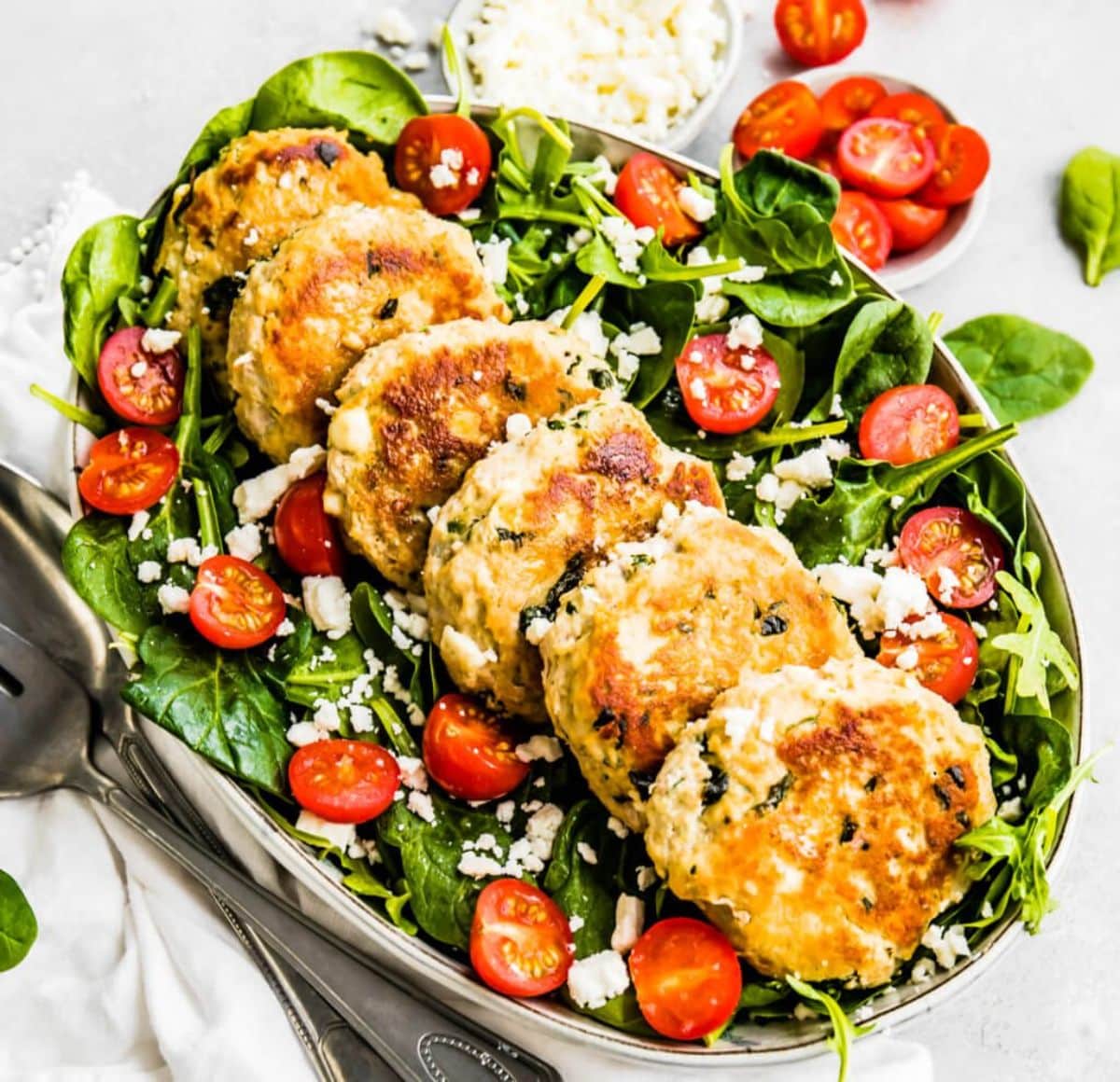 Feta & Spinach Chicken Patties on a tray.