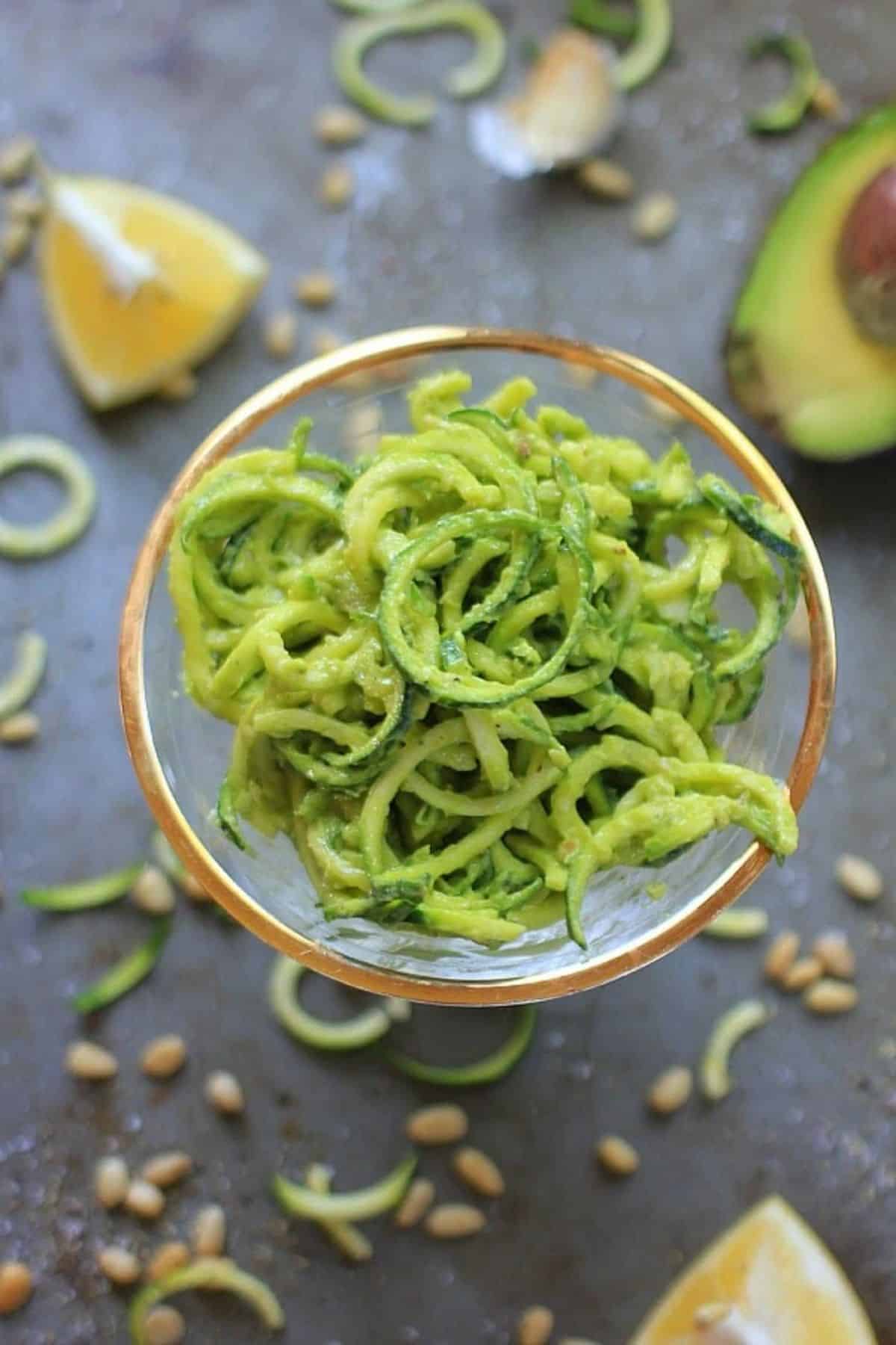 Easy Vegan Zucchini Noodles with Avocado Pesto in a small bowl.