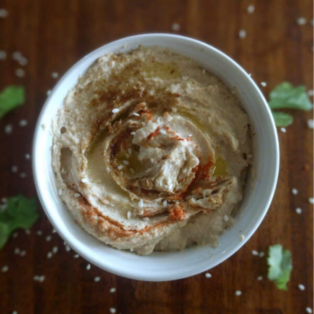 Tahini Hummus in a white bowl.