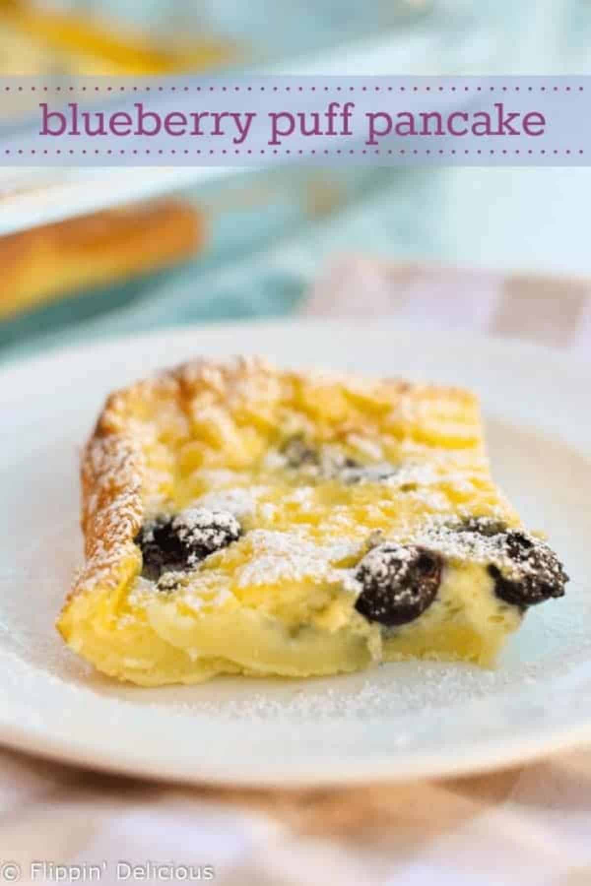 Gluten-free Blueberry Puff Pancake on a white plate.