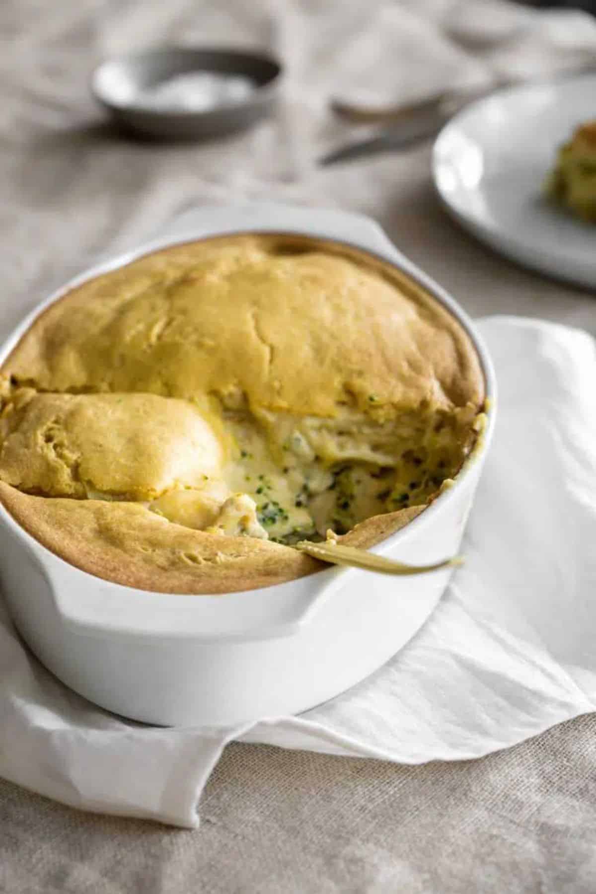 Creamy Vegan Potato Broccoli in a white casserole.