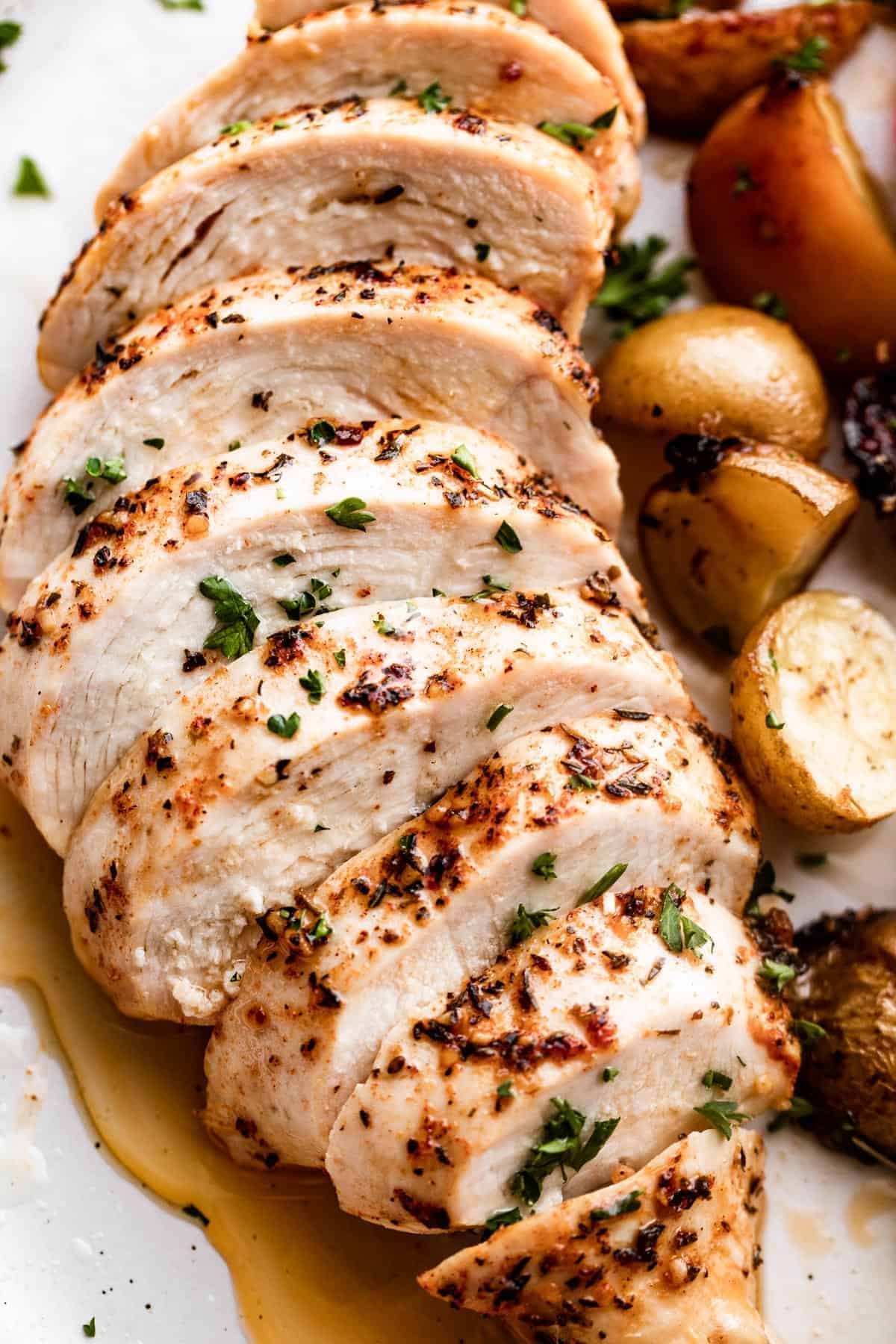 Gluten-Free Slow Cooker Chicken Breast with potatoes on a white plate.