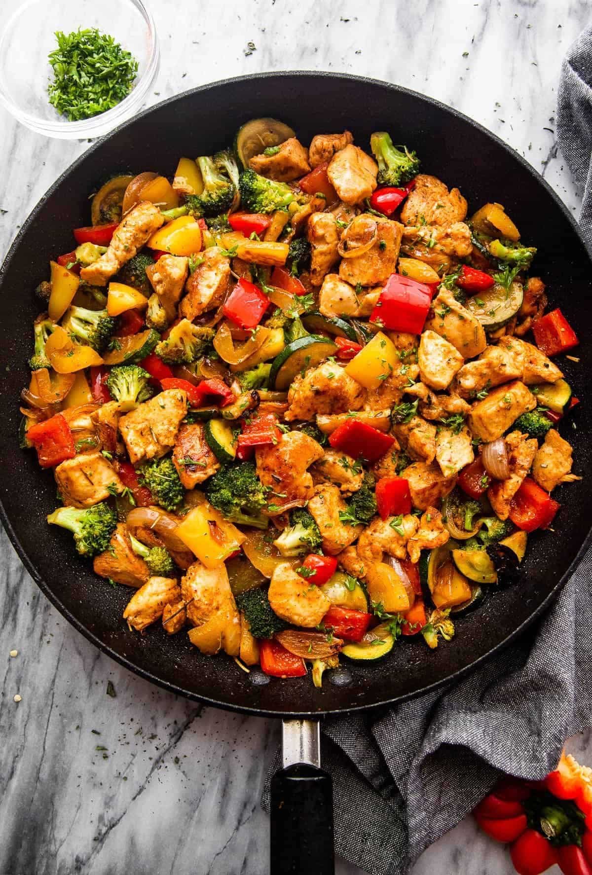 Gluten-Free Chicken and Vegetables in a black pan.