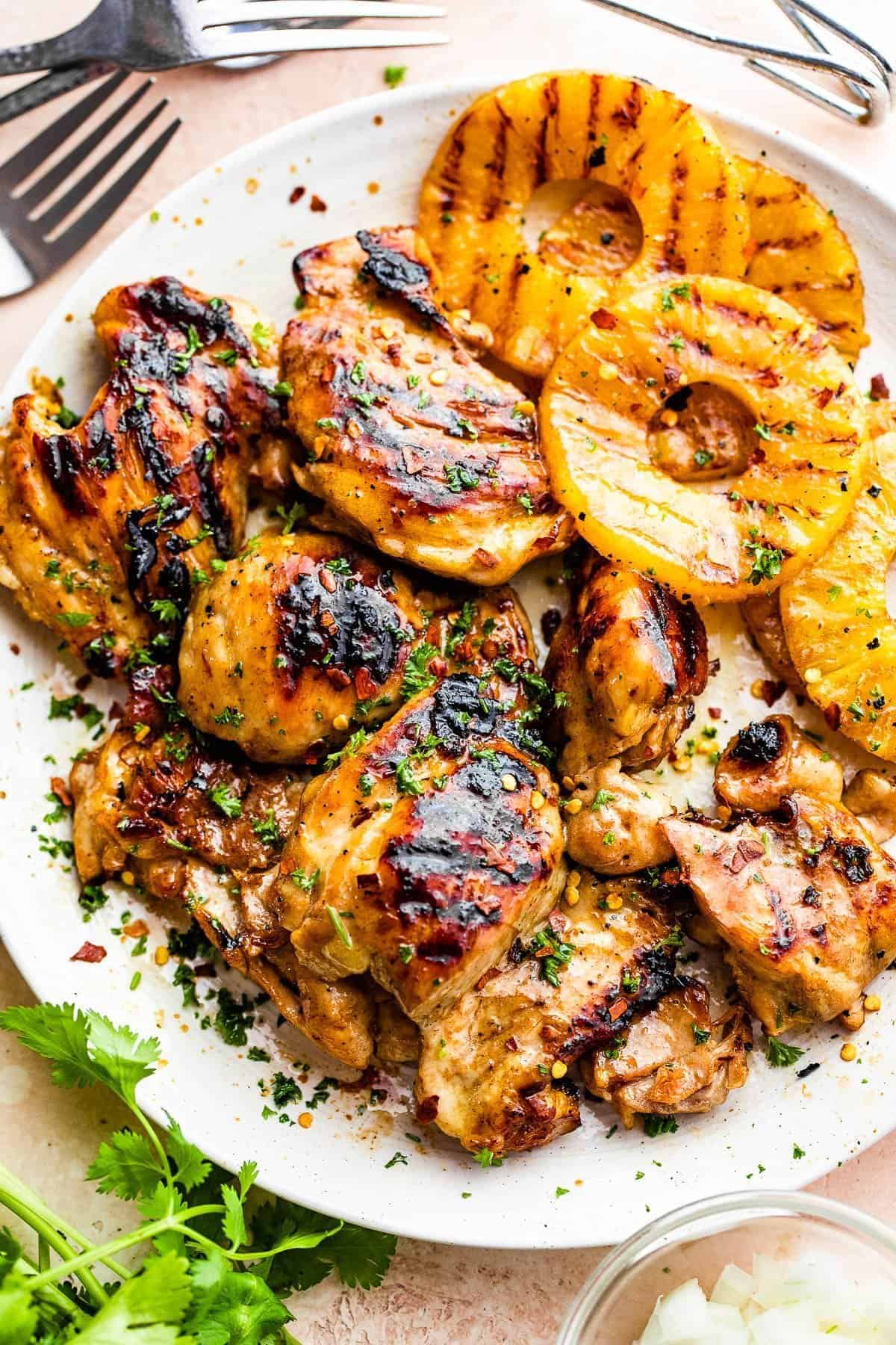 Beer Marinated Grilled Chicken Thighs on a white plate.