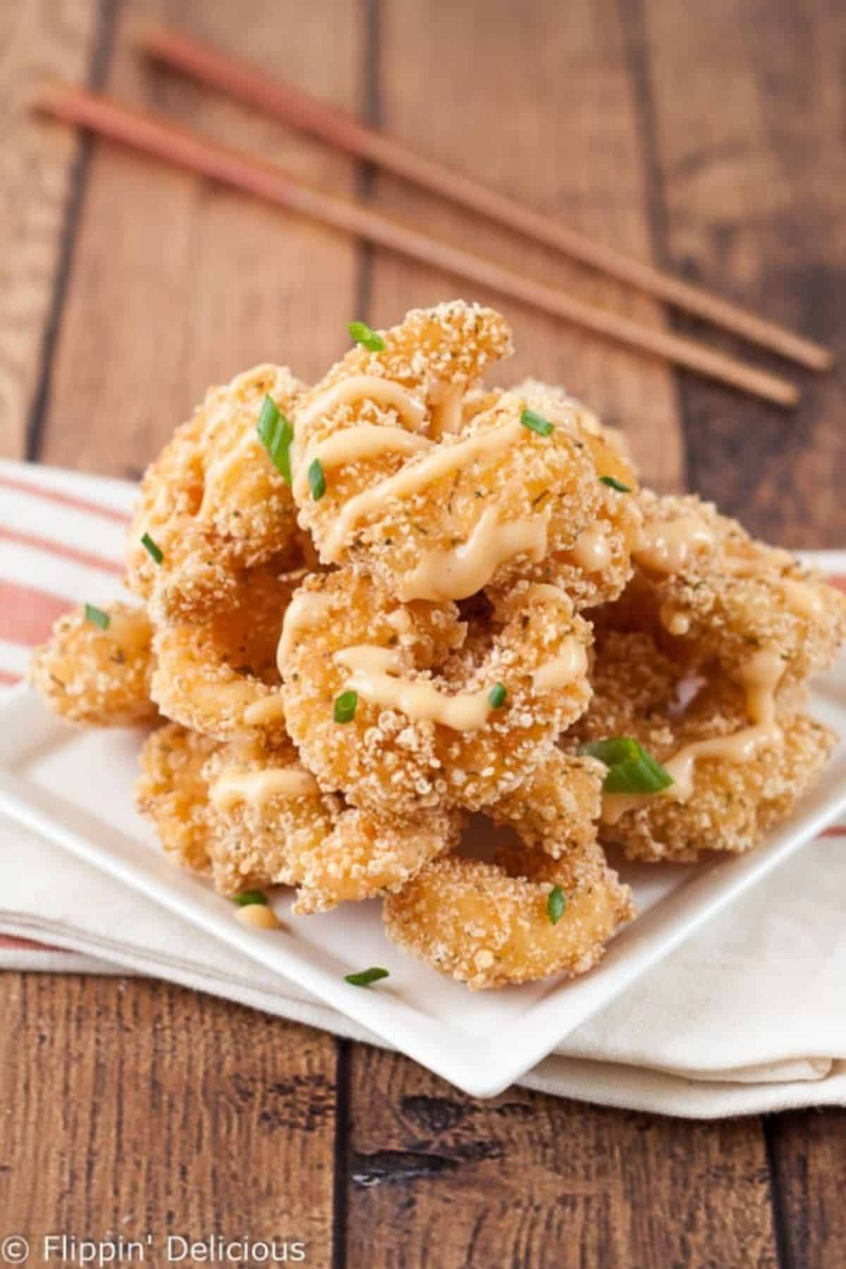 Gluten-Free Bang Bang Shrimps on a white plate.