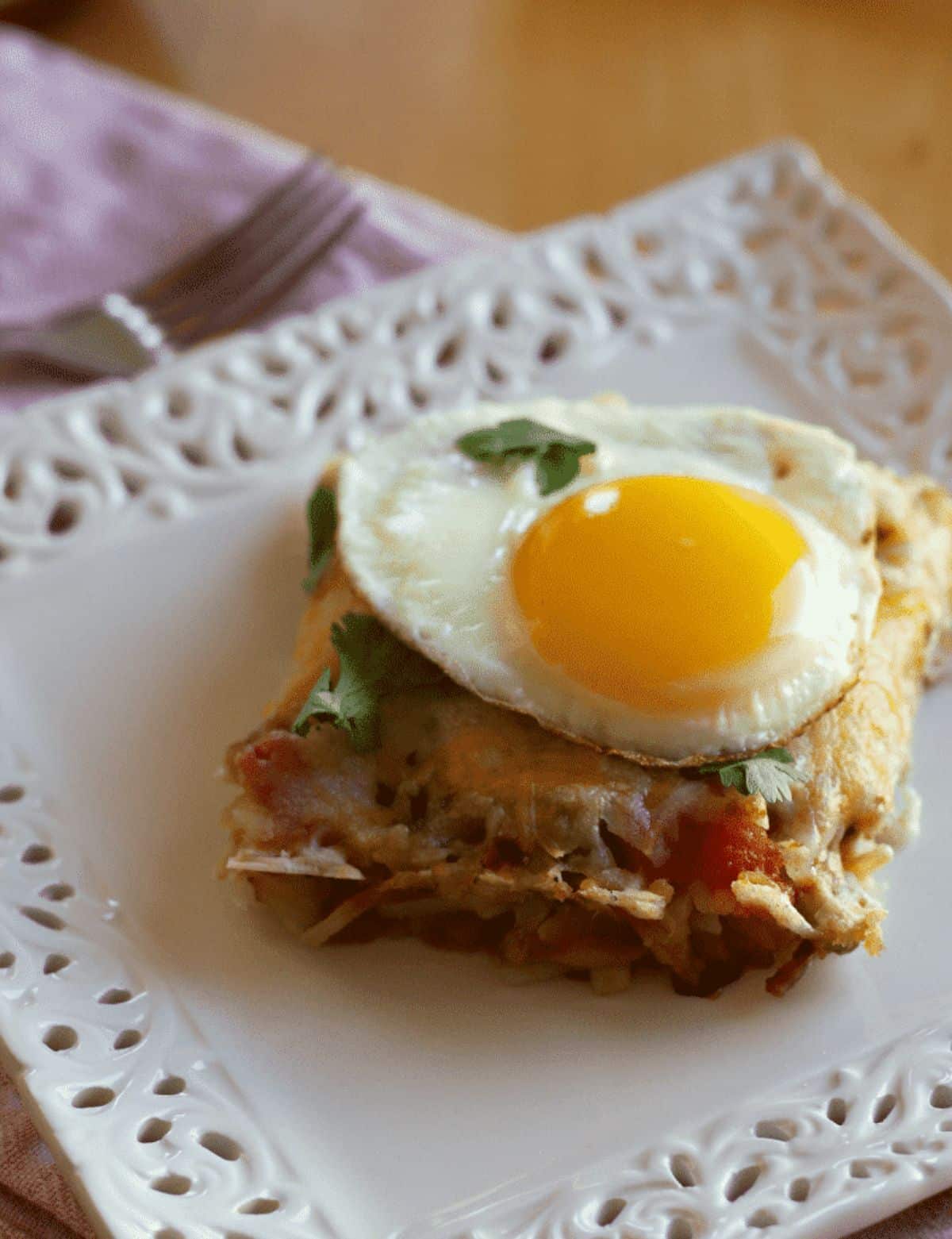 Huevos Rancheros Hashbrowns Casserole dish on a white plate.