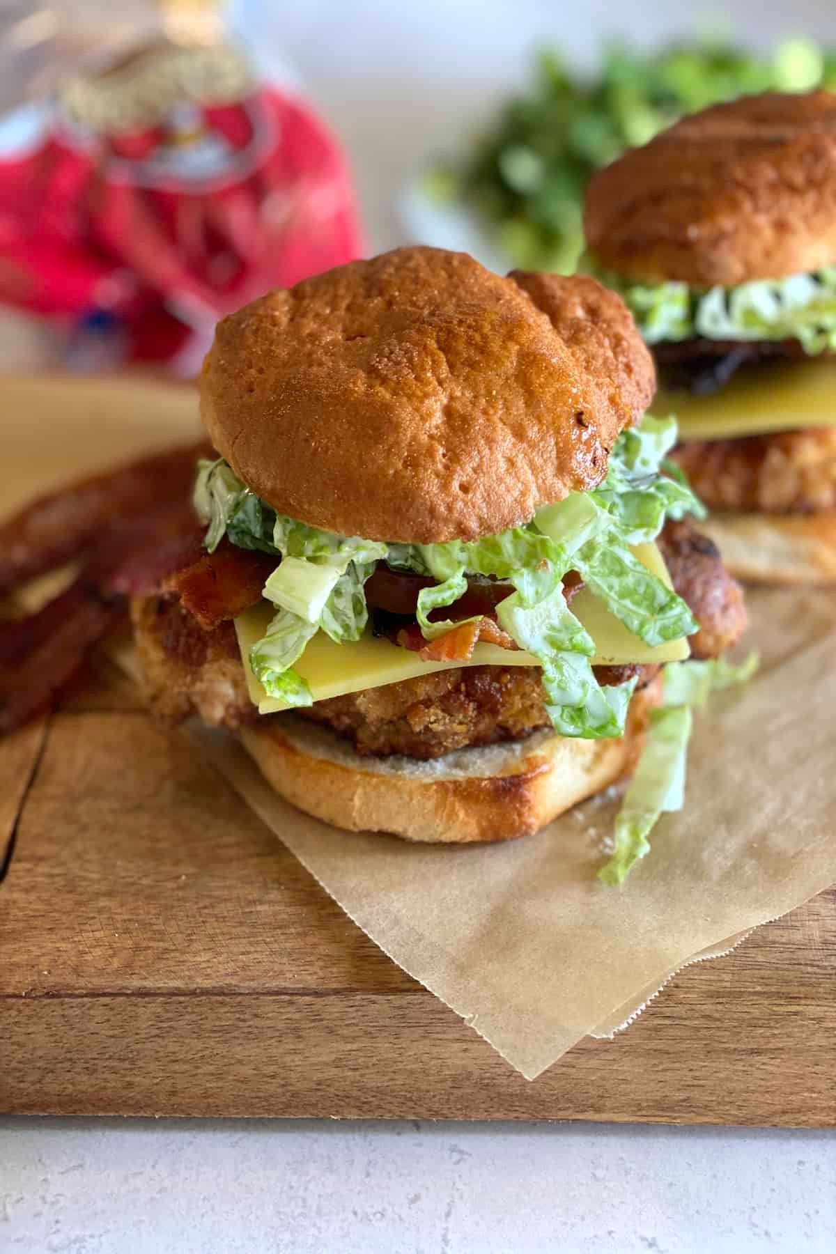 Chick-Fil-A Copycat Gluten-Free Chicken Sandwich on a wooden cutting board.