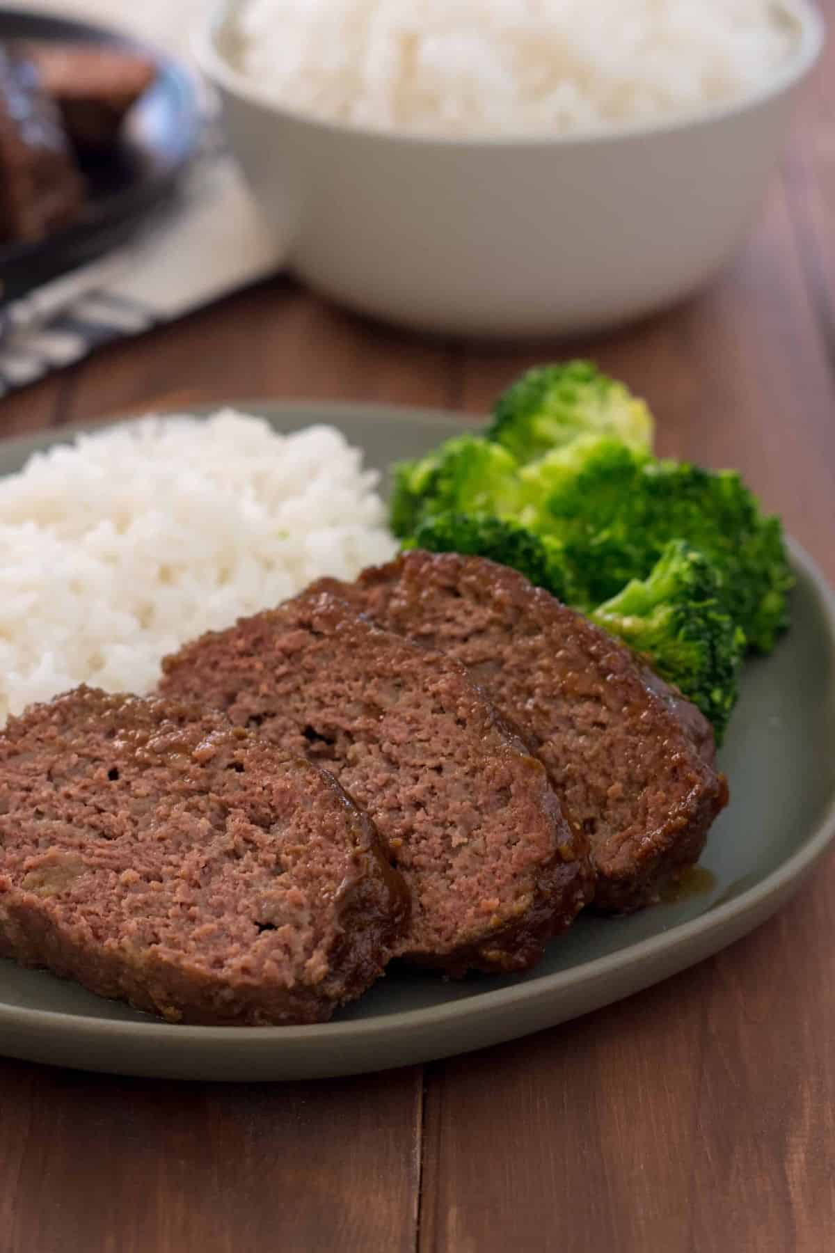 Instant Pot Gluten Free Teriyaki Meatloaf with broccoli and rice on a gray plate.