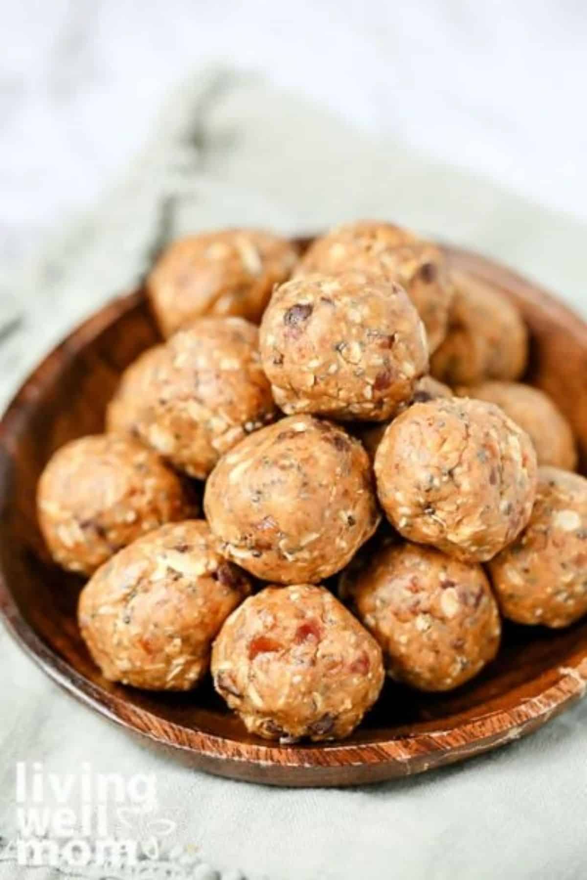 Peanut Butter Date Energy Balls in a wooden bowl.