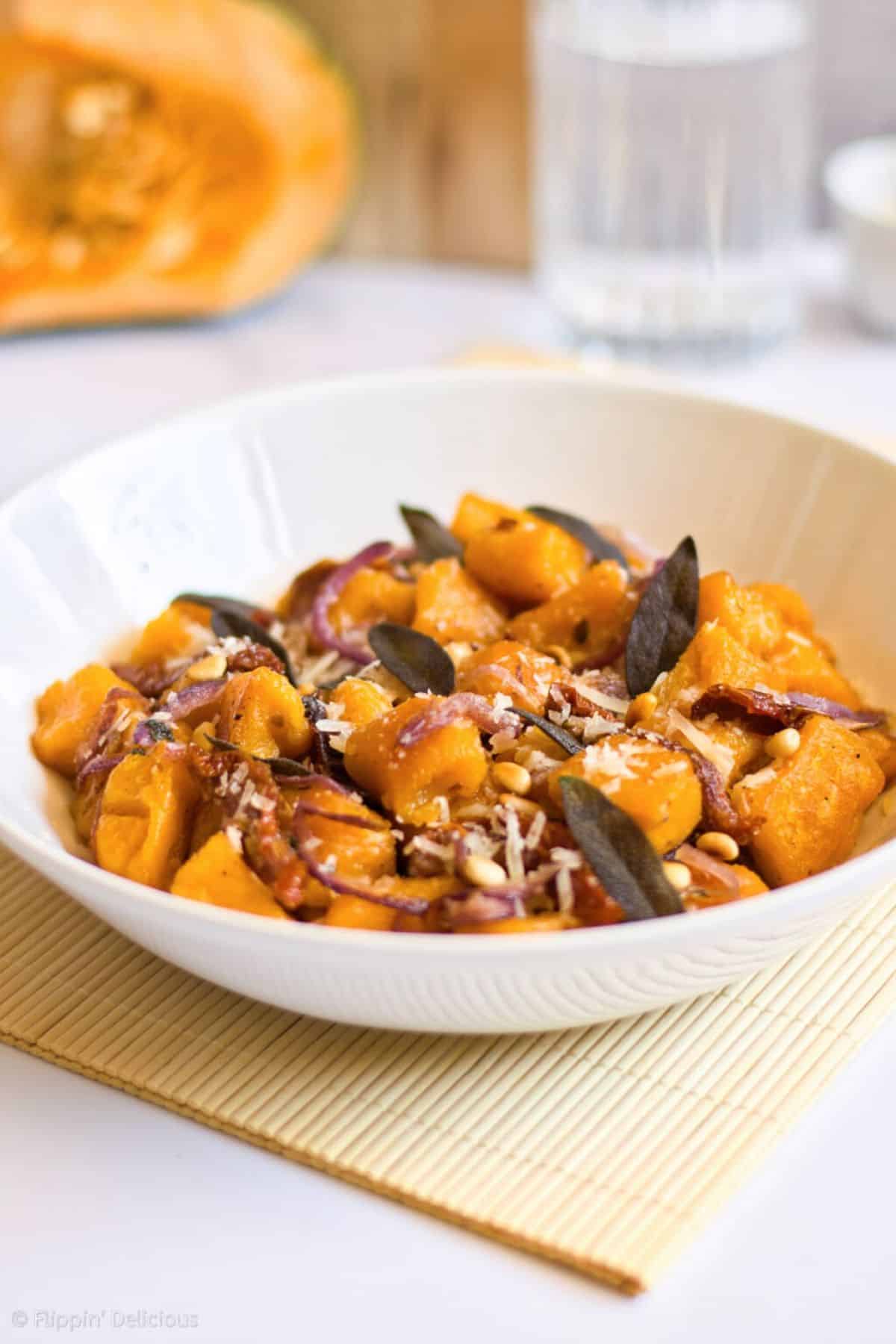 Delicious Gluten-Free Vegan Pumpkin Gnocchi in a white bowl.