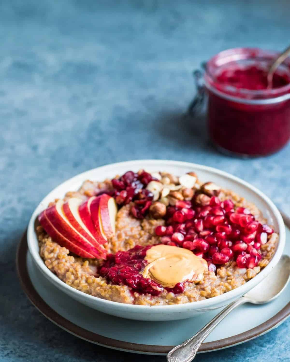 Instant Pot Pear and Date Spiced Oatmeal on a white plate.