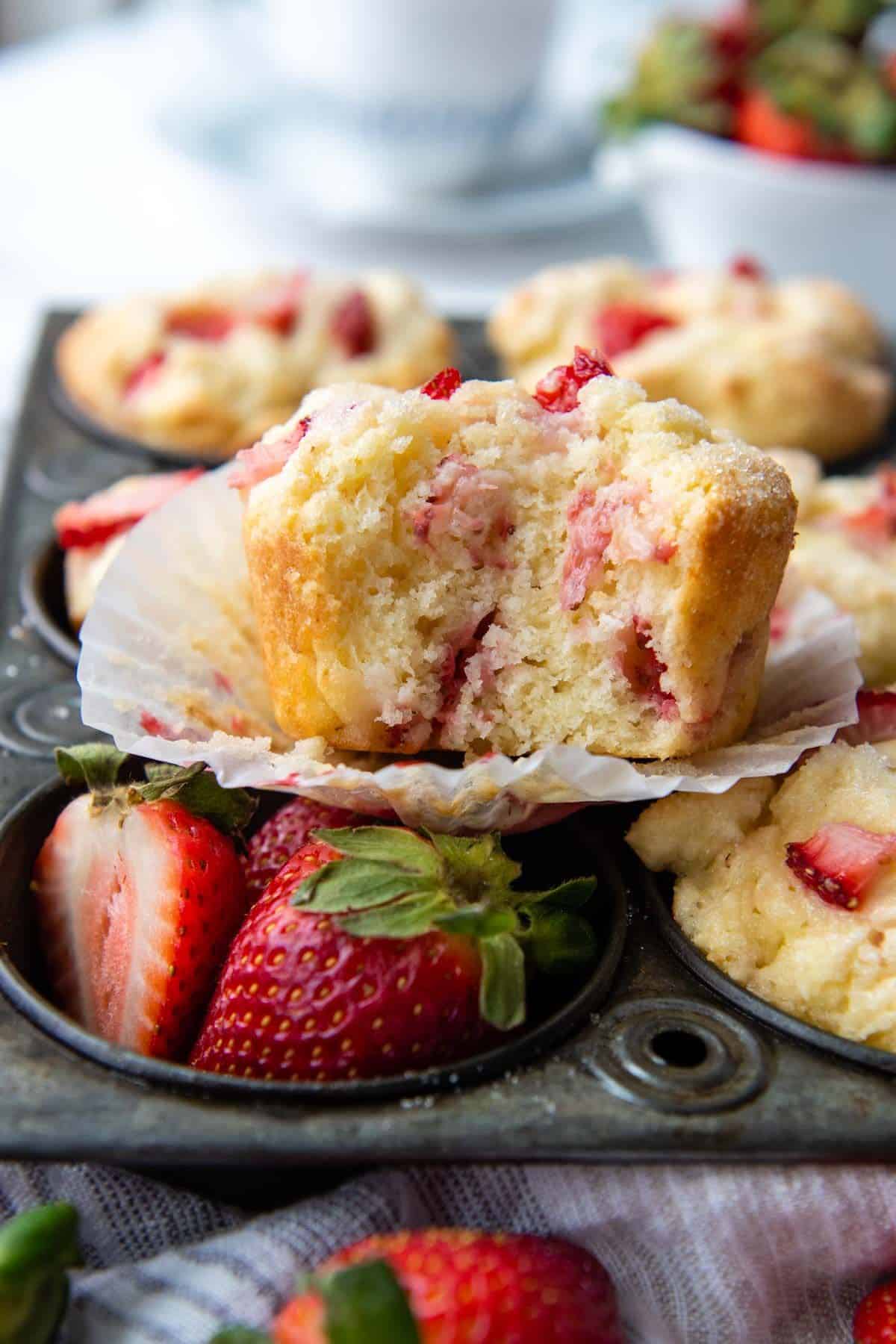 Delicious Gluten-Free Strawberry Muffins in a muffin tray.