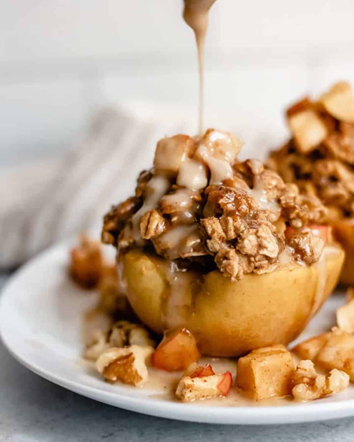 Delicious Apple Crisp Stuffed Baked Apples on a white tray.