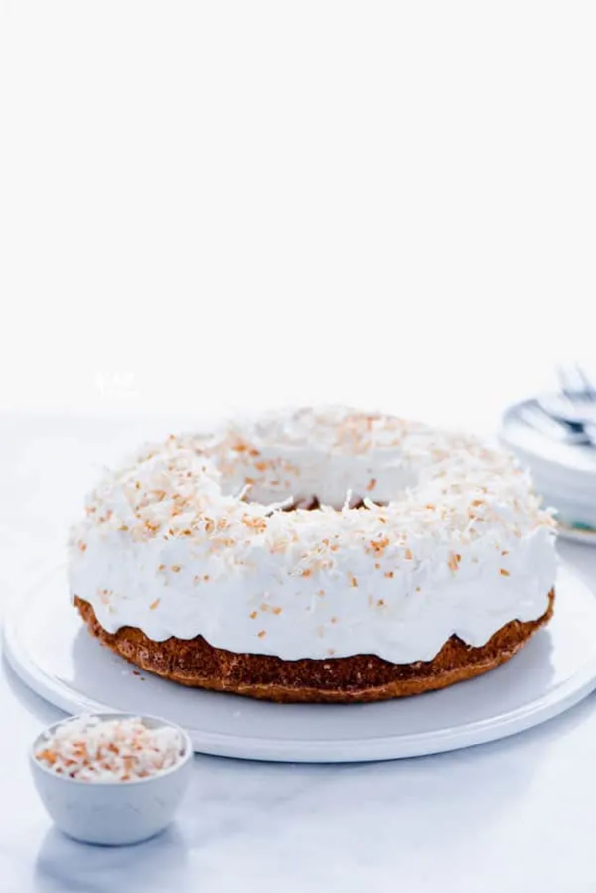 Yummy Gluten-Free Coconut Pound Cake on a white ray.