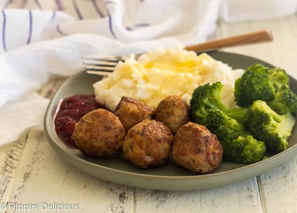 Delicious Gluten-Free Meatballs with mashed potatoes, broccoli on a gray plate.