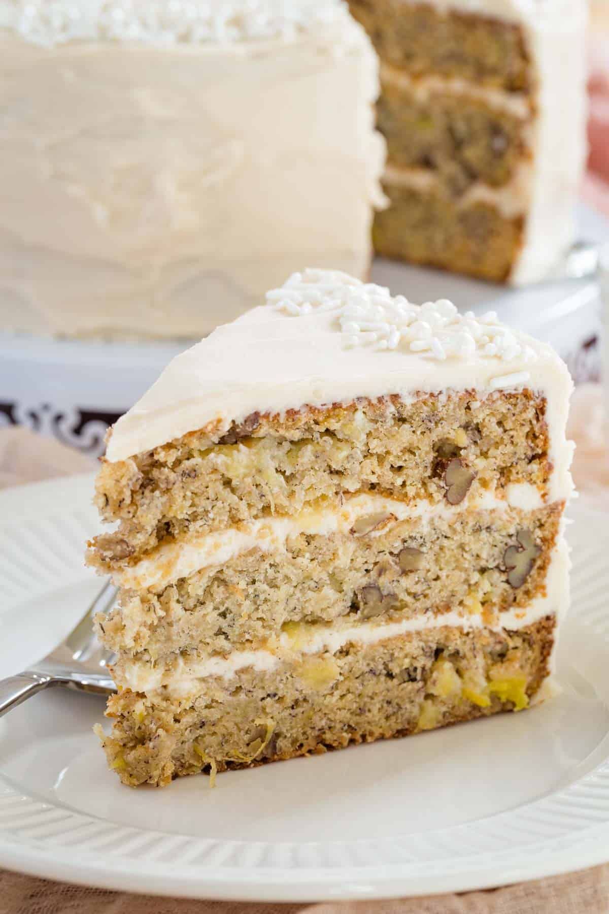 A piece of delicious Gluten-Free Hummingbird Cake on a white plate.