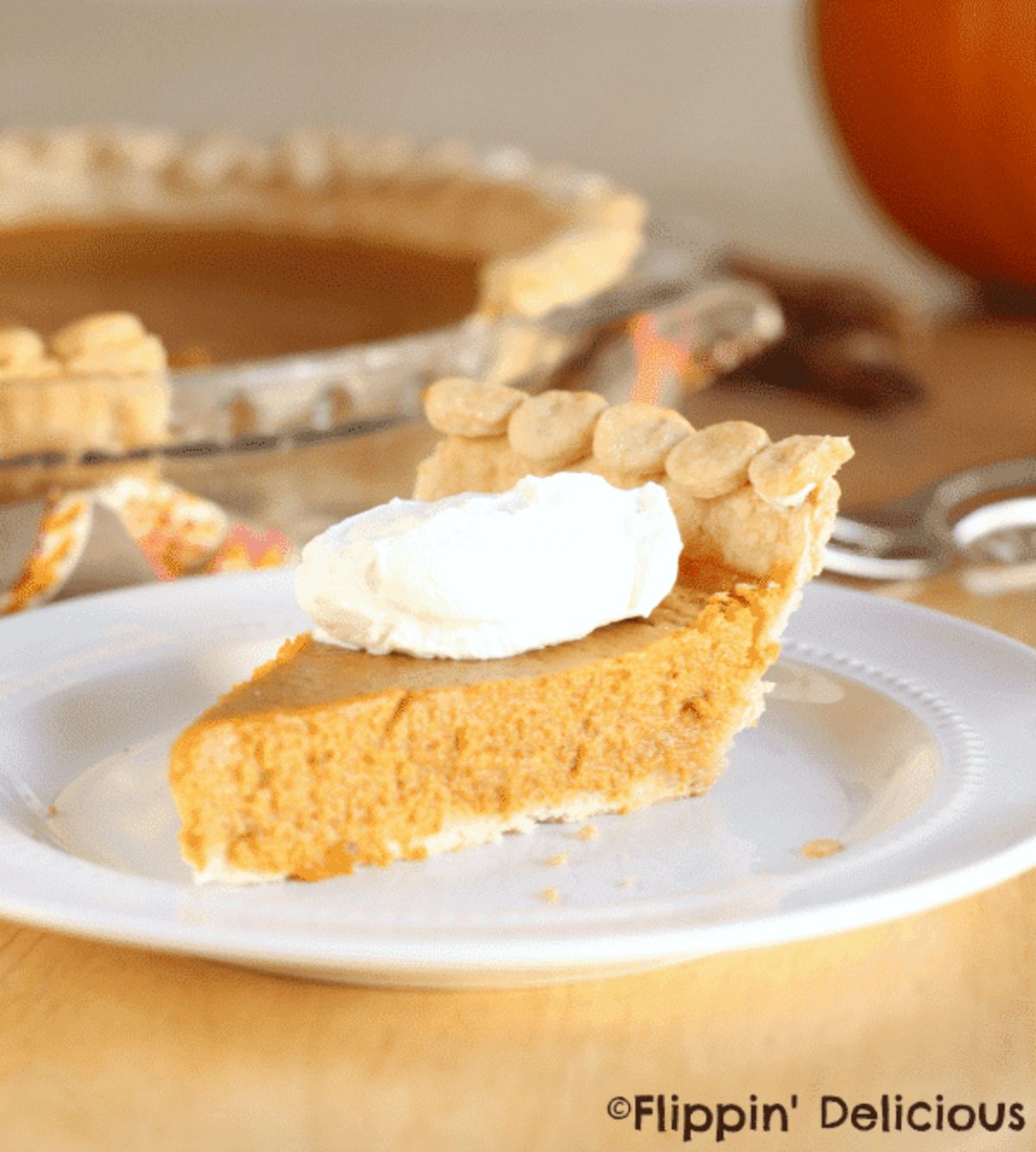 A piece of Gluten-Free Honey Pumpkin Pie on a white plate.