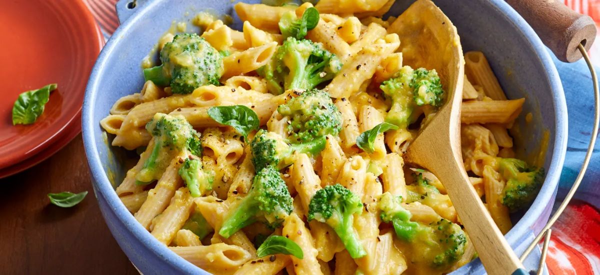 Butternut Squash Mac and Cheese with Broccoli in a blue bowl.