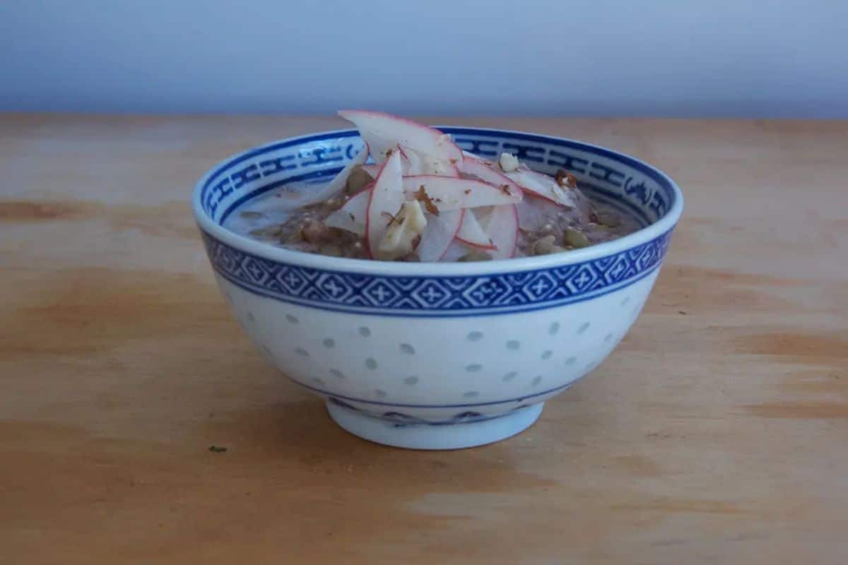 Apple Cinnamon Quinoa Porridge in a blue bowl.