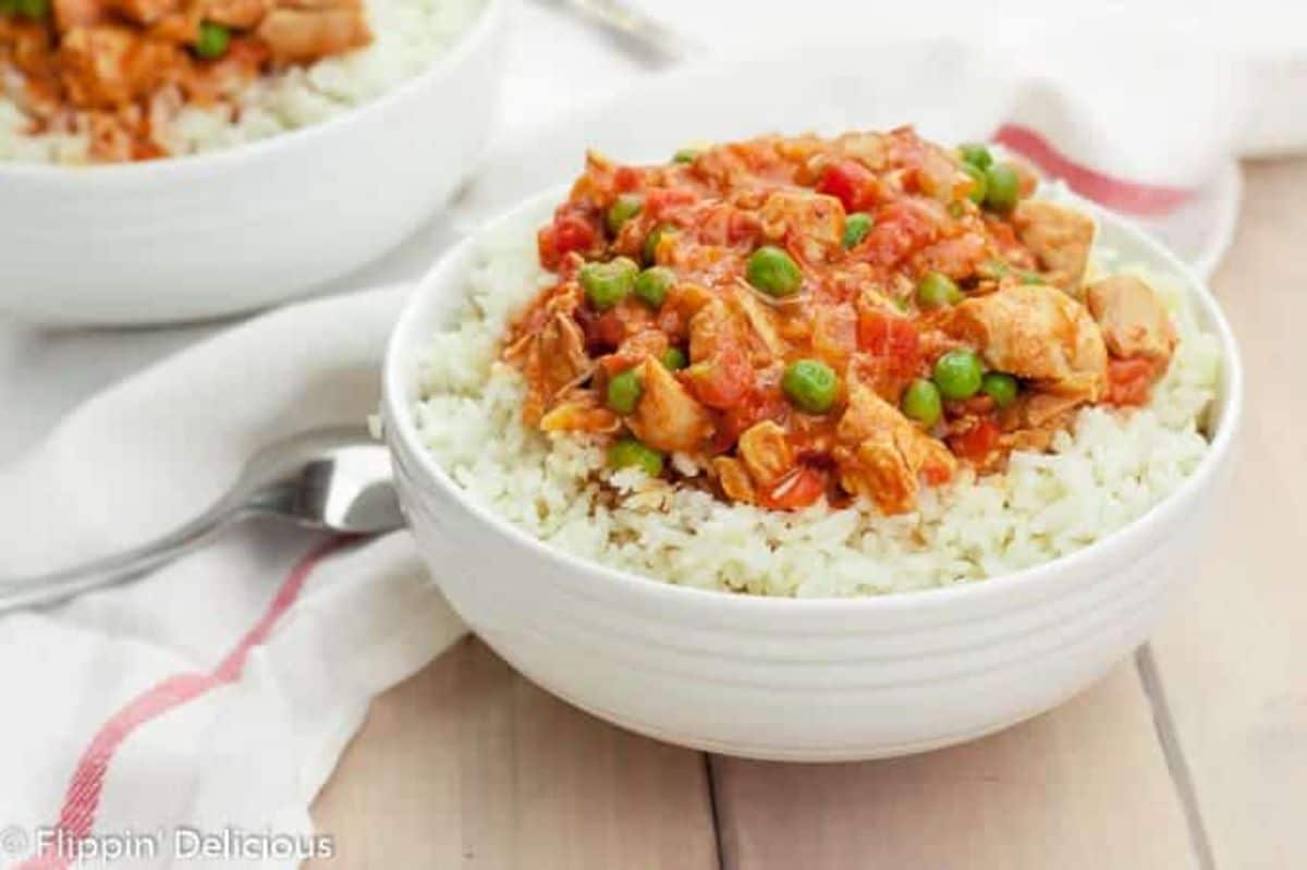 Gluten-Free Instant Pot Chicken Tikka Masala with rice in a white bowl.