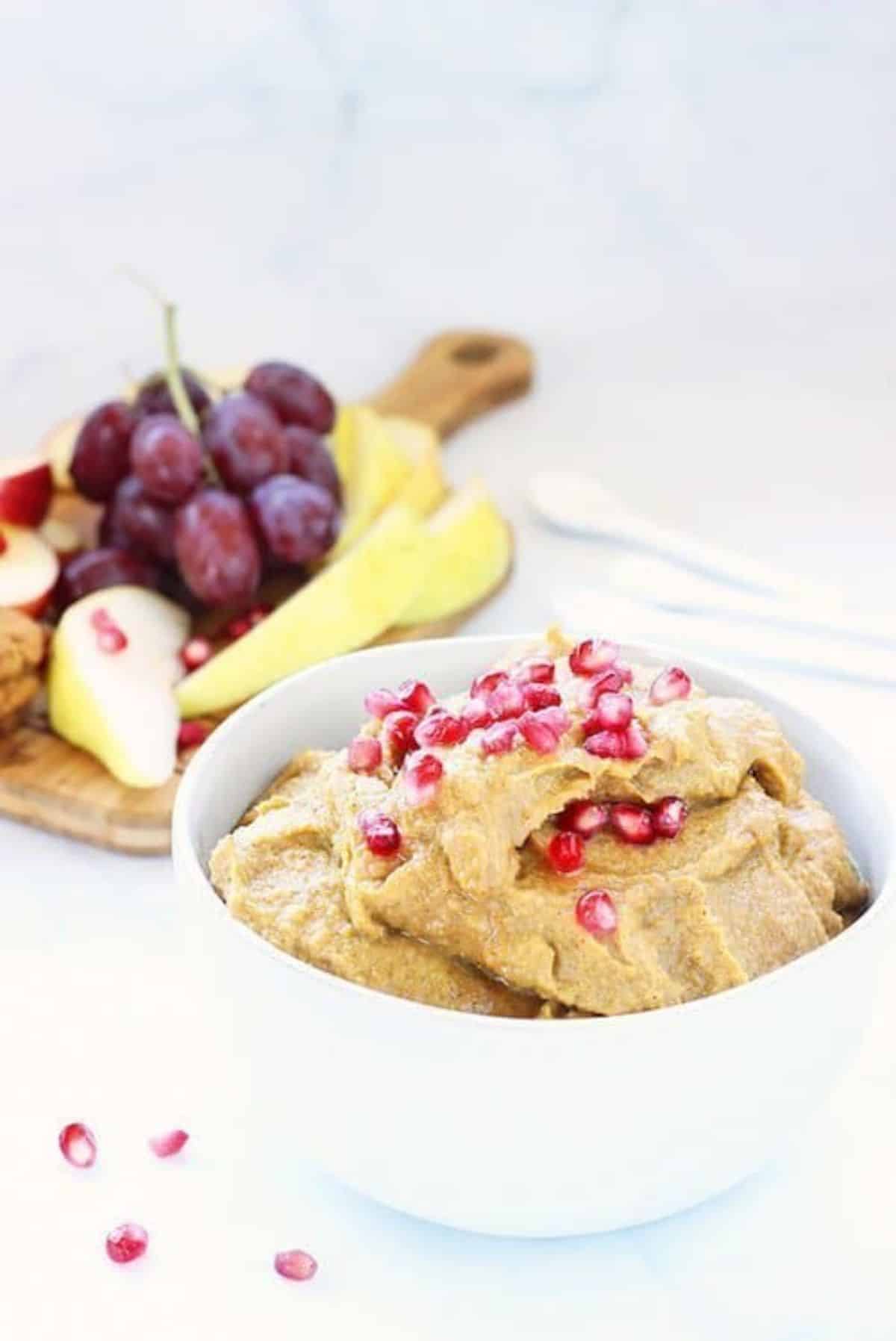 A delicious Pumpkin Pie Dessert Hummus in a white bowl.