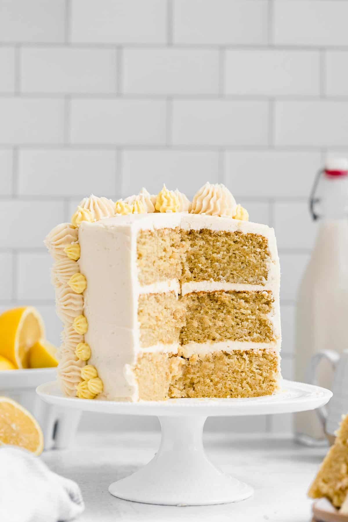 Scrumptious Gluten-Free Lemon Cake on a white cake tray.
