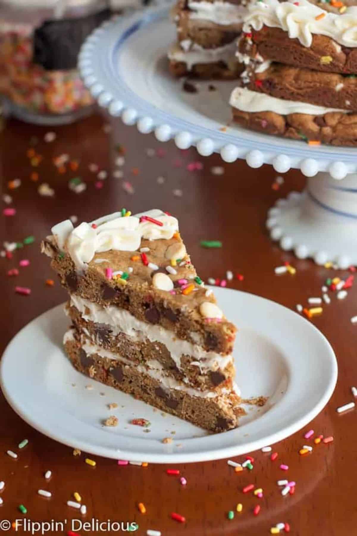 A piece of delicious Gluten-Free Cookie Cake on a white plate.